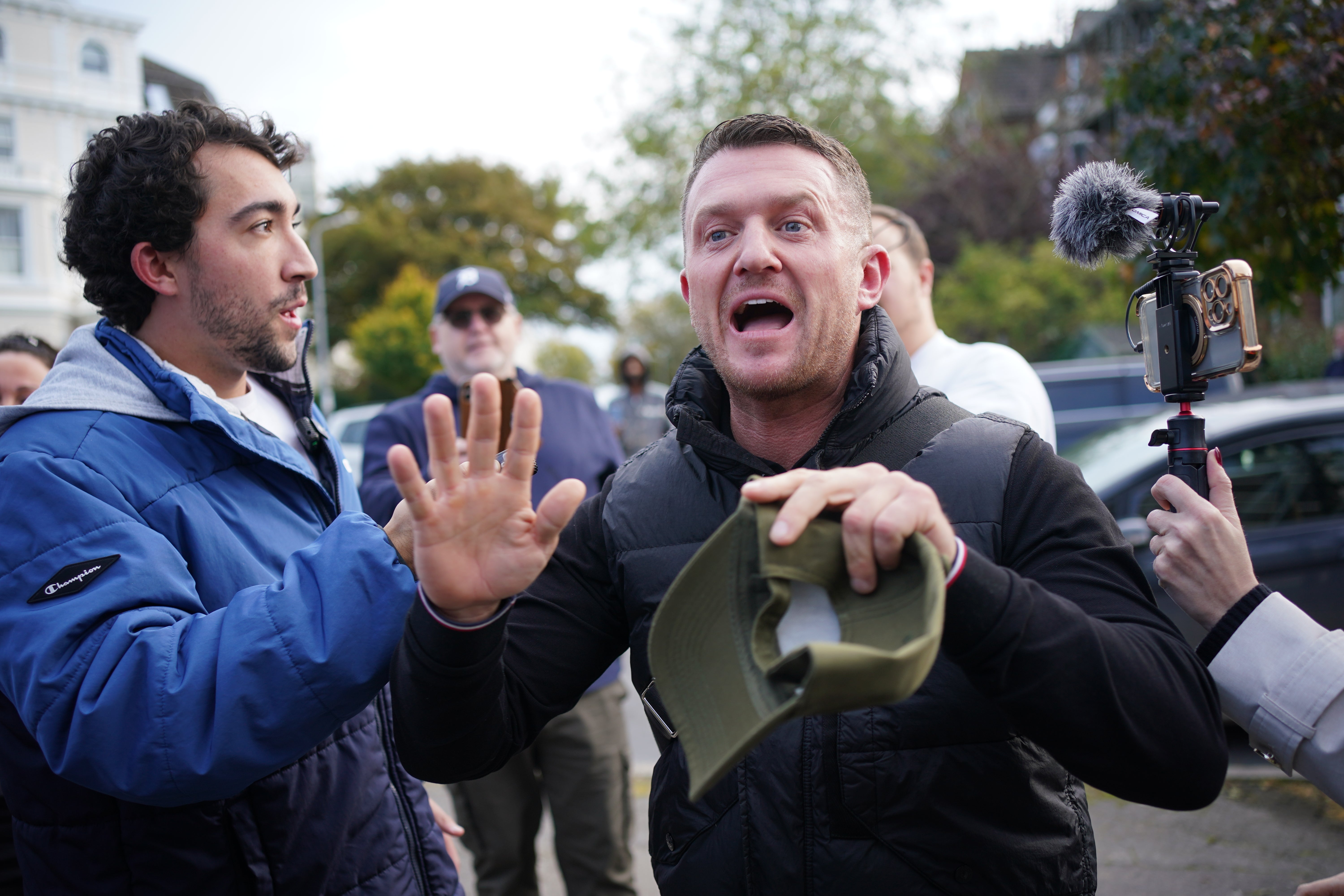 Robinson hugged supporters who cheered as he entered Folkestone Police Station