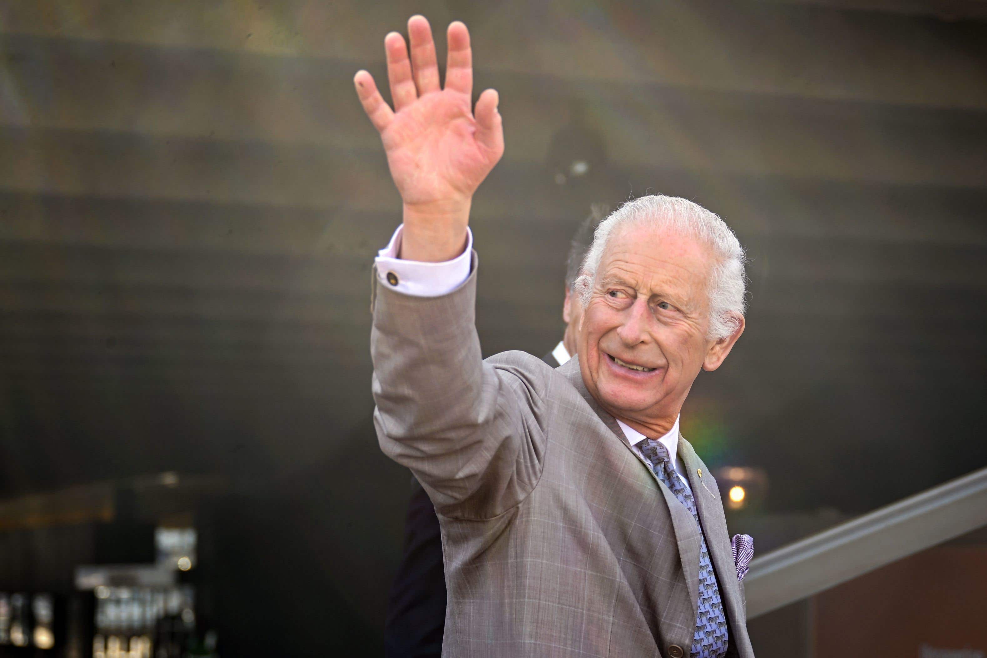 The King waves during his visit to Sydney Opera House (Victoria Jones/PA)