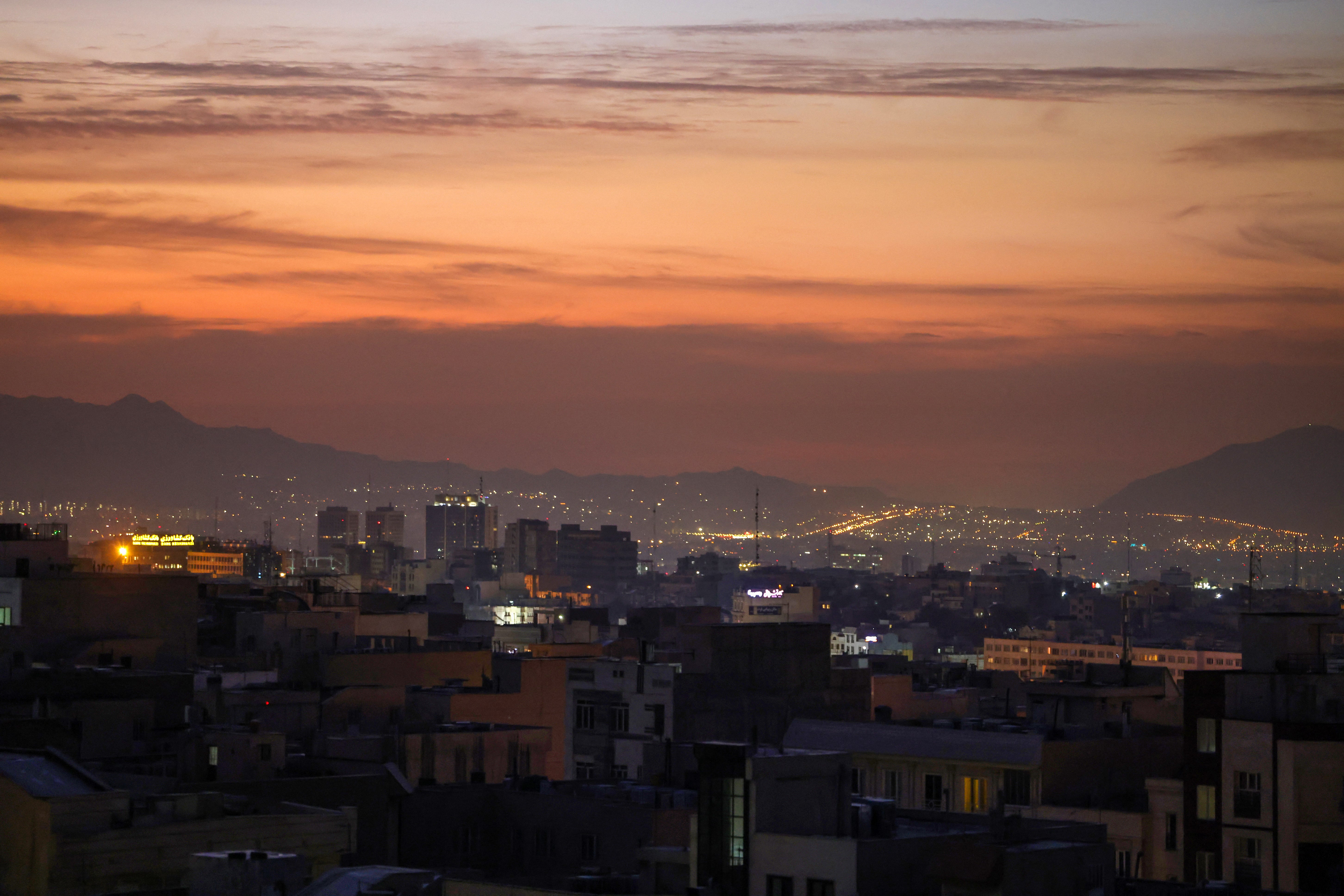 Part of the city skyline is pictured at dawn after several explosions were heard in Tehran on 26 October 2024