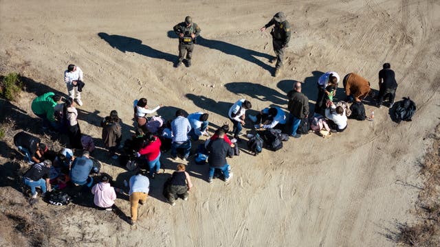 <p>An aerial view of US Border Patrol agents holding asylum seekers near the Mexico border on 22 September 2024</p>