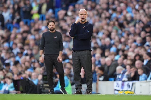 Manchester City manager Pep Guardiola and Southampton manager Russell Martin, left, on the touchline (Martin Rickett/PA)