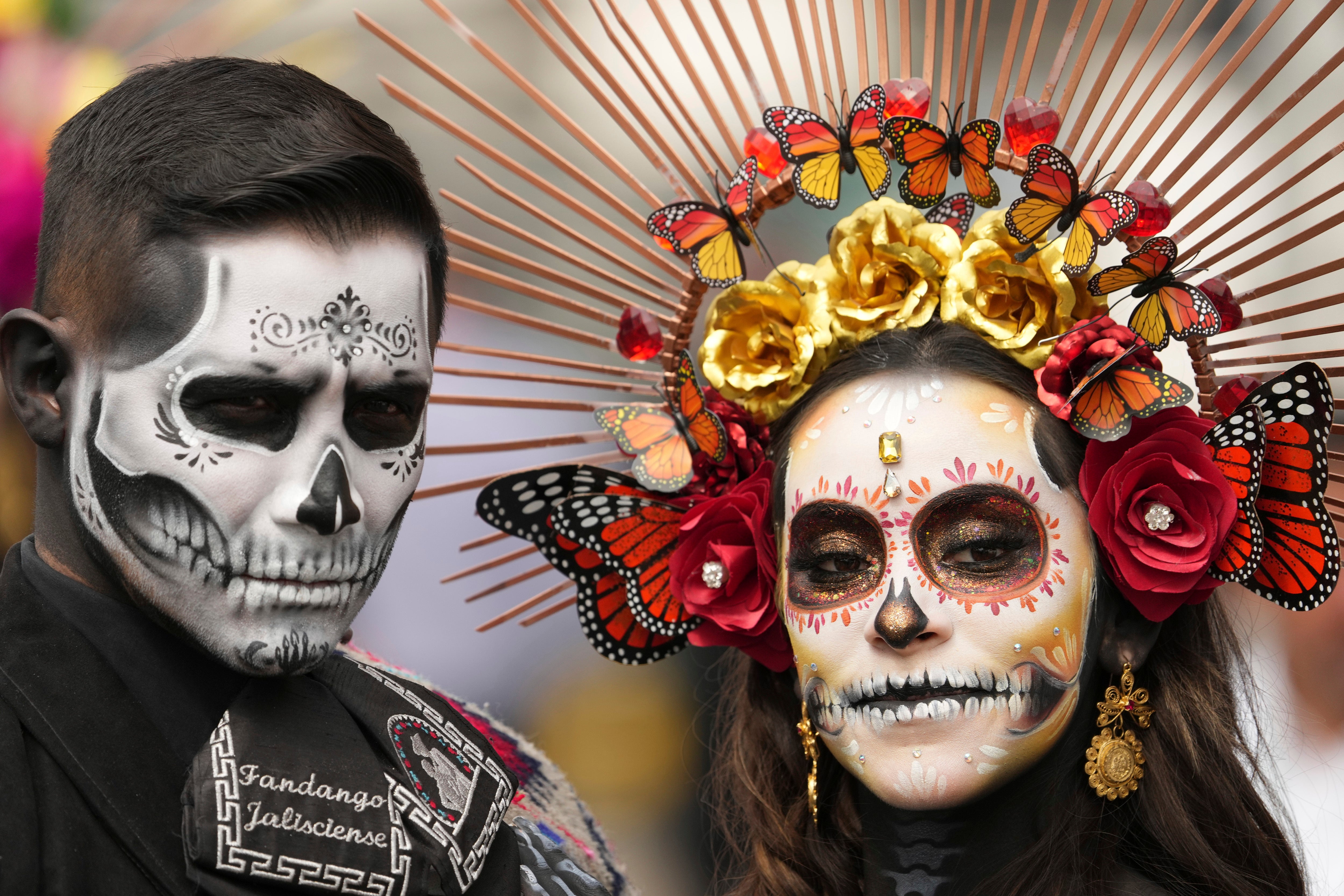 Actors dressed in Day of the Dead costumes welcome drivers at the Hermanos Rodriguez racetrack