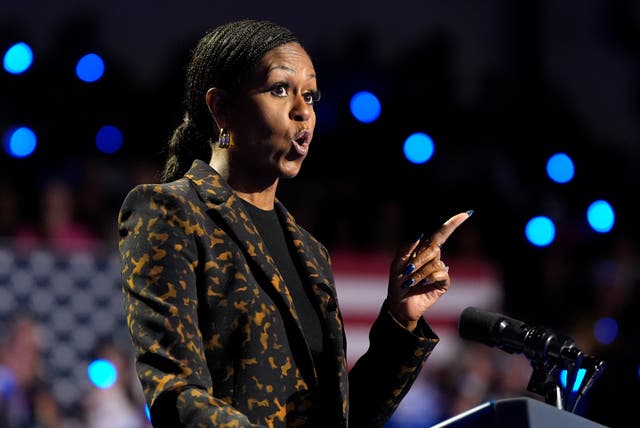 <p>Michelle Obama slammmed ‘predator’ Donald Trump as she delivered a bleak warning for the future of reproductive health at a campaign rally for Kamala Harris in Michigan on October 26. </p>