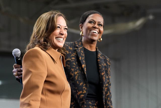 <p>Former first lady Michelle Obama, right, and Democratic presidential nominee Vice President Kamala Harris address the crowd in the overflow space of a campaign rally at the Wings Event Center in Kalamazoo, Michigan. The Obamas and the Clintons congratulated Doanld Trump and JD Vance on their Election Day victory </p>