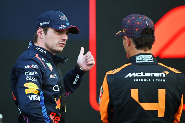 <p>Second placed qualifier Max Verstappen talks with third placed qualifier Lando Norris</p>