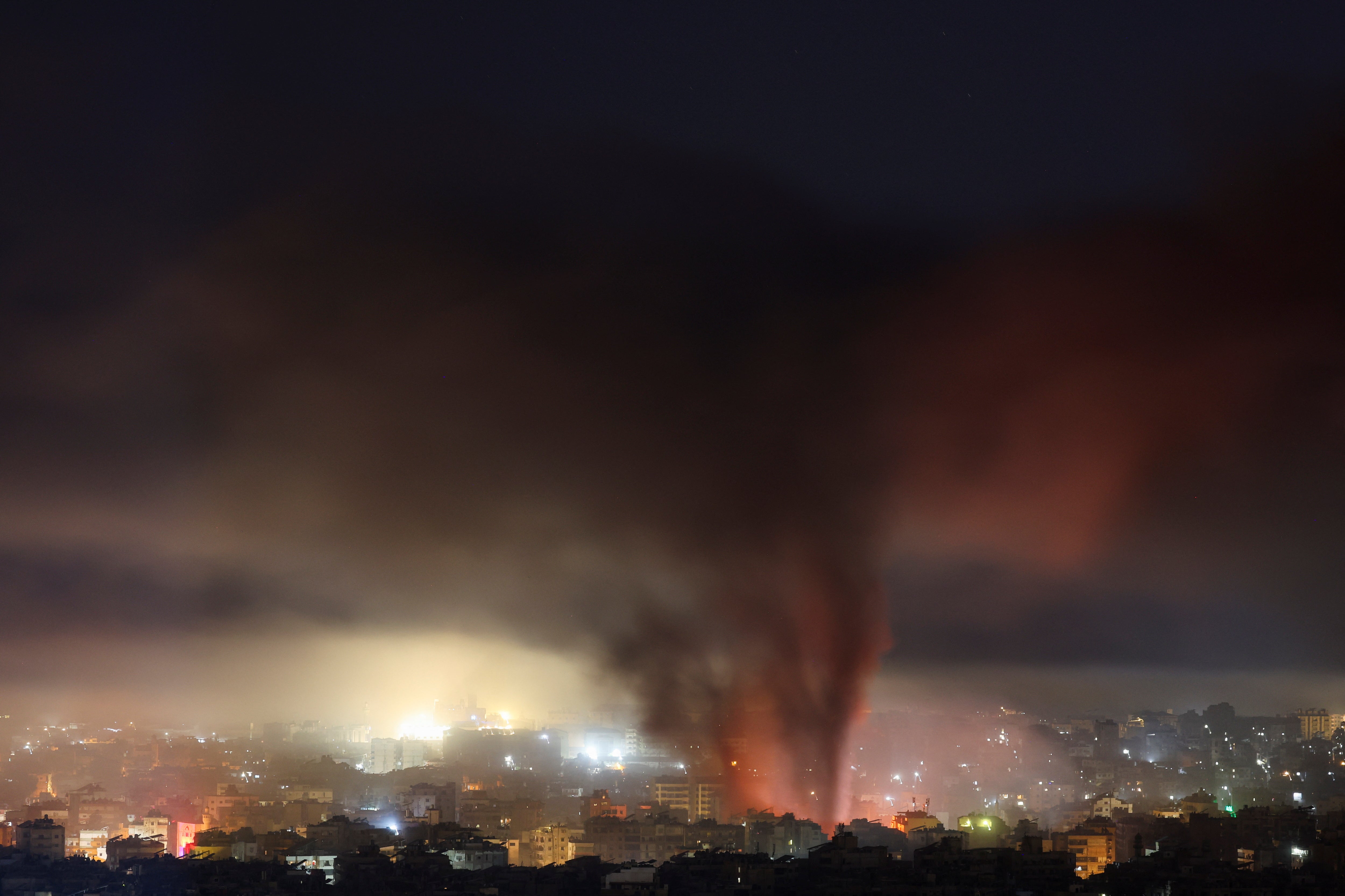 Smoke billows over Beirut’s southern suburbs, after an Israeli strike, amid the ongoing hostilities between Hezbollah and Israeli forces, as seen from Baabda, Lebanon, 27 October 2024