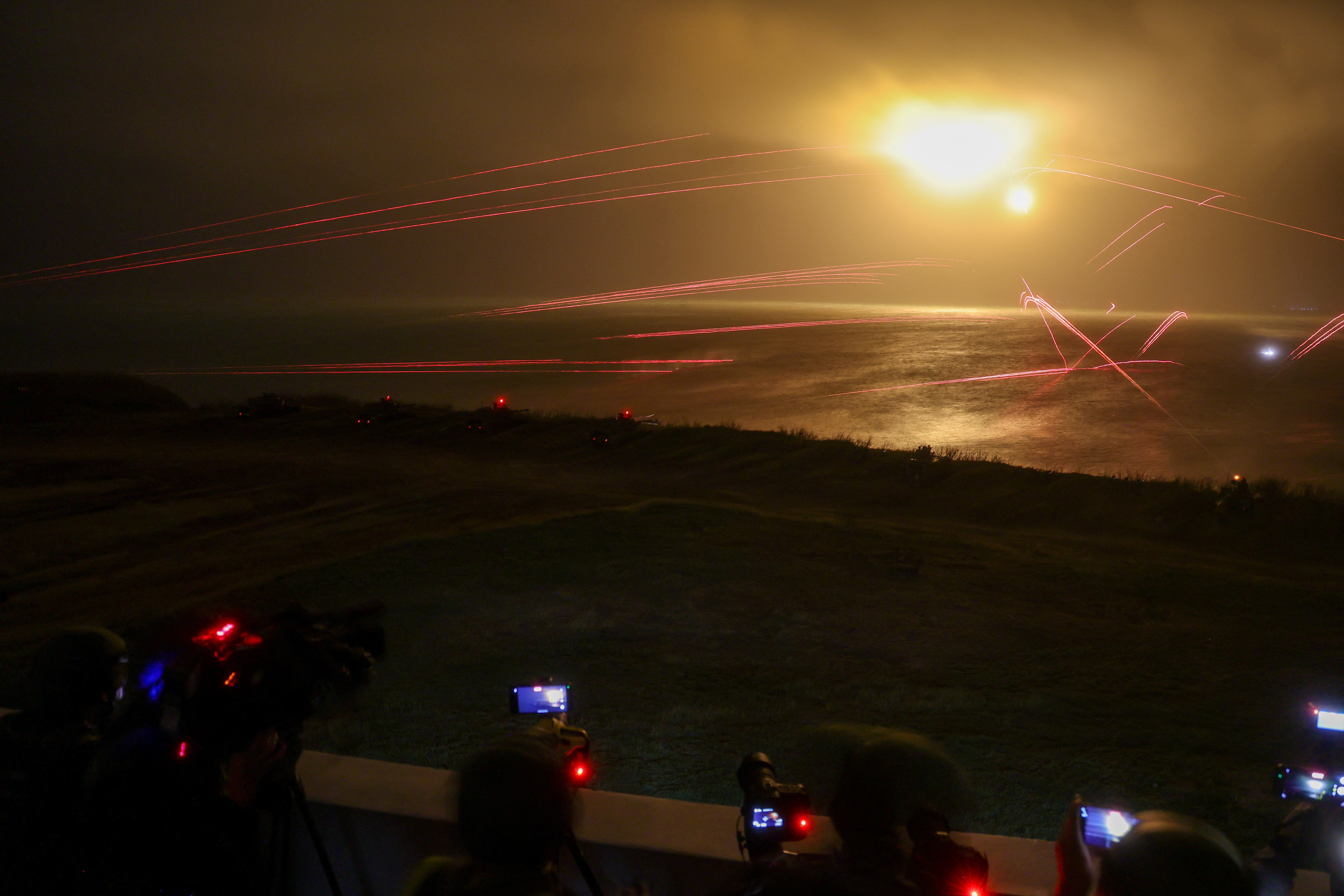 <p>Flares and live rounds are fired during a night-time drill on Penghu Islands, Taiwan, on 24 October 2024</p>
