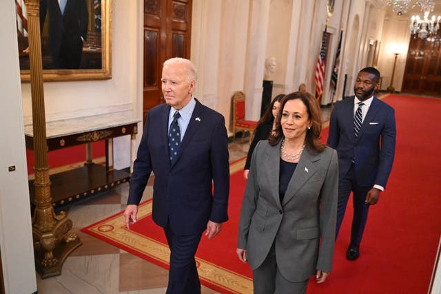 <p>President Joe Biden and Vice President Kamala Harris walk to an event on gun violence in the East Room of the White House in Washington, DC, on September 26.  The Harris team has reportedly been unwilling to allow the president to campaign for her </p>