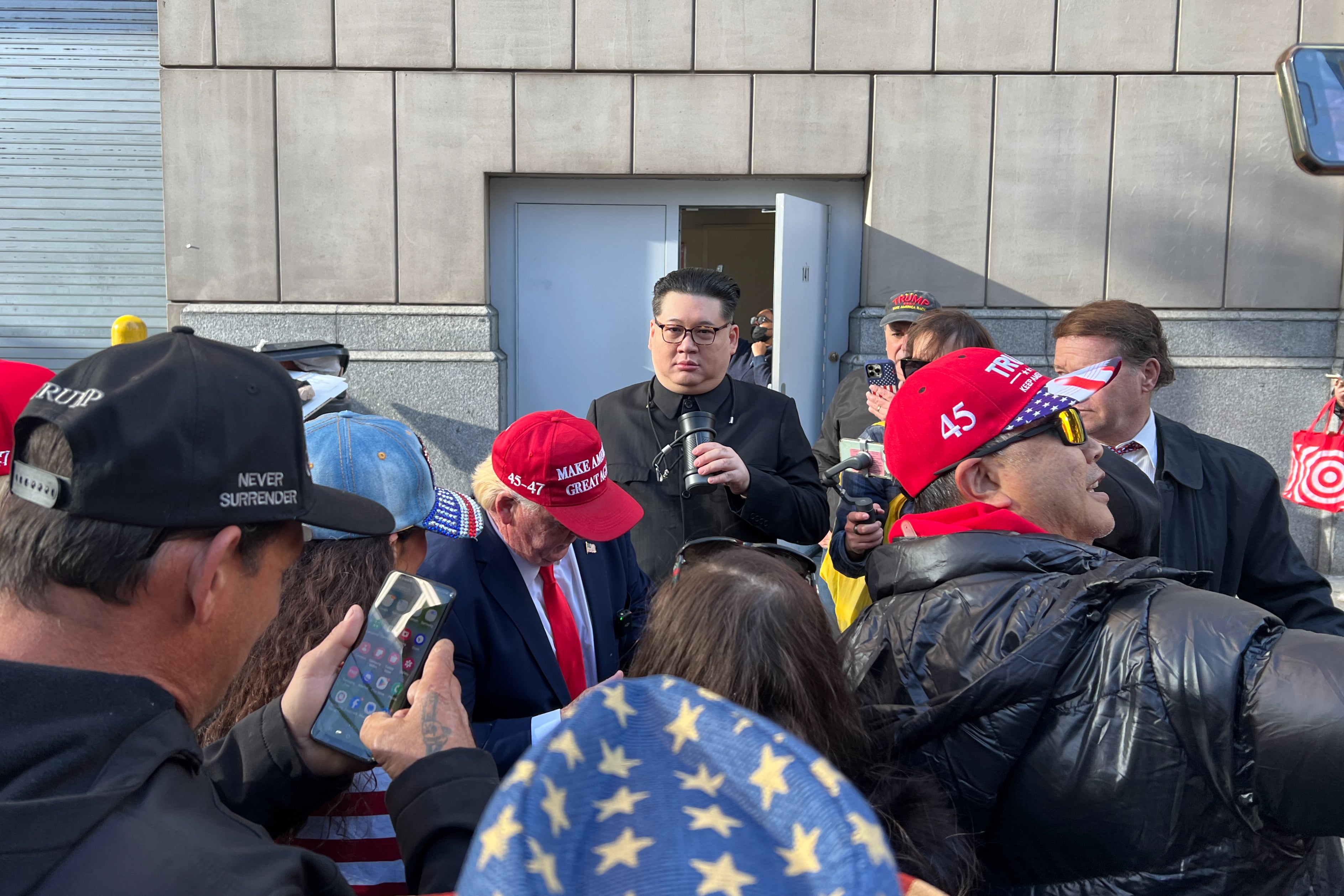 A man impersonating North Korean dictator Kim Jong Un visits with Trump supporters waiting to get into MSG on Sunday