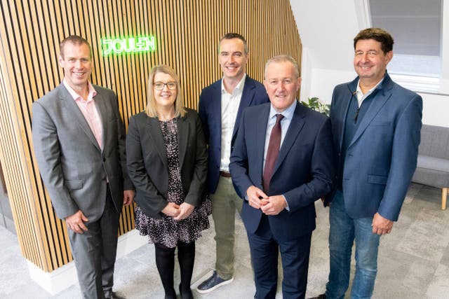 From left, Steve Harper, executive director of international business and skills at Invest NI; Sharon Cousins, client manager, Invest NI; Chris Doherty, managing director of Joulen; Economy Minister Conor Murphy; and Hans Jorg Holzenbein, chief executive and co-founder of SonneNext (Handout/PA)