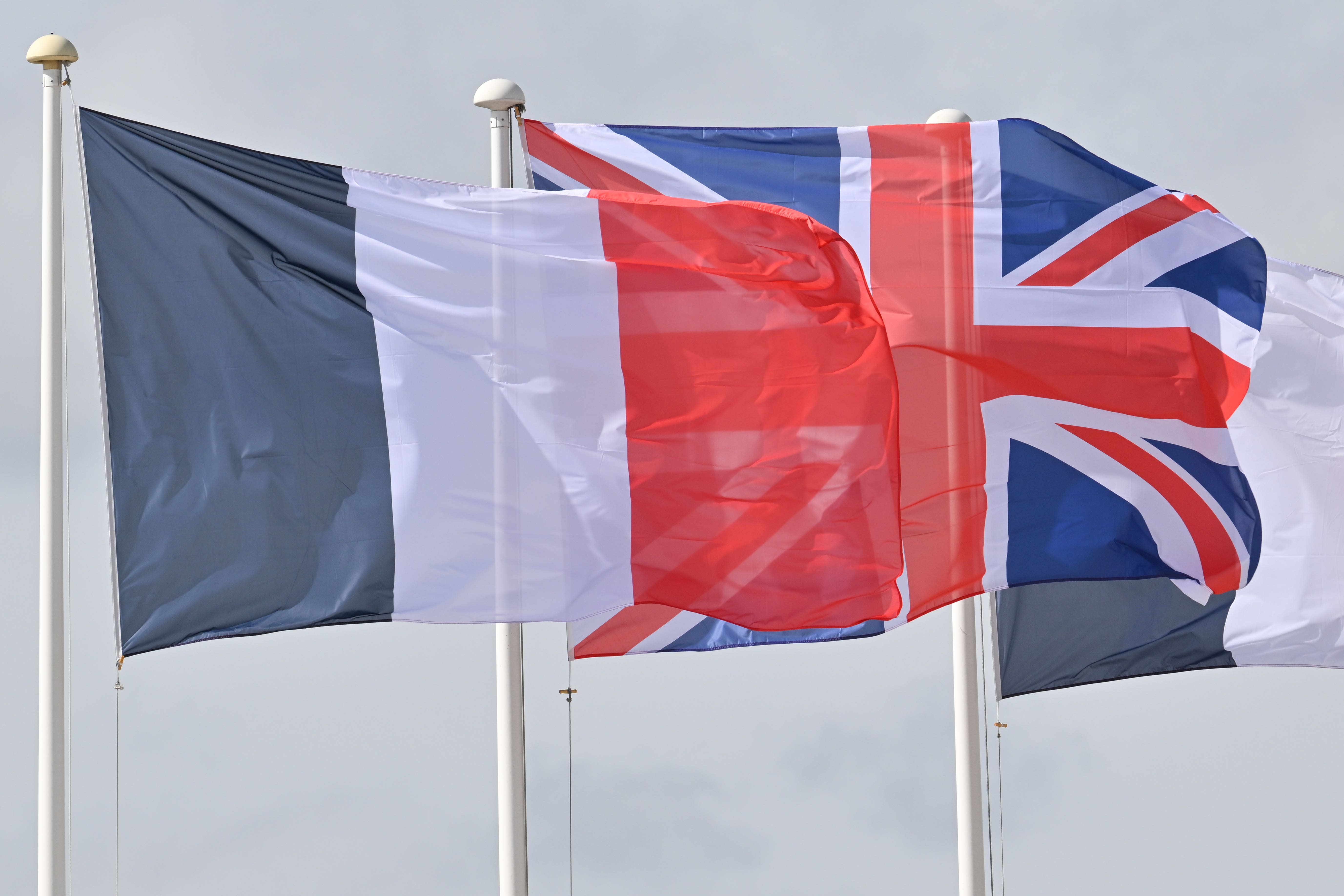 The Tricolore and the Union Jack are flown (Tim Rooke / PA).