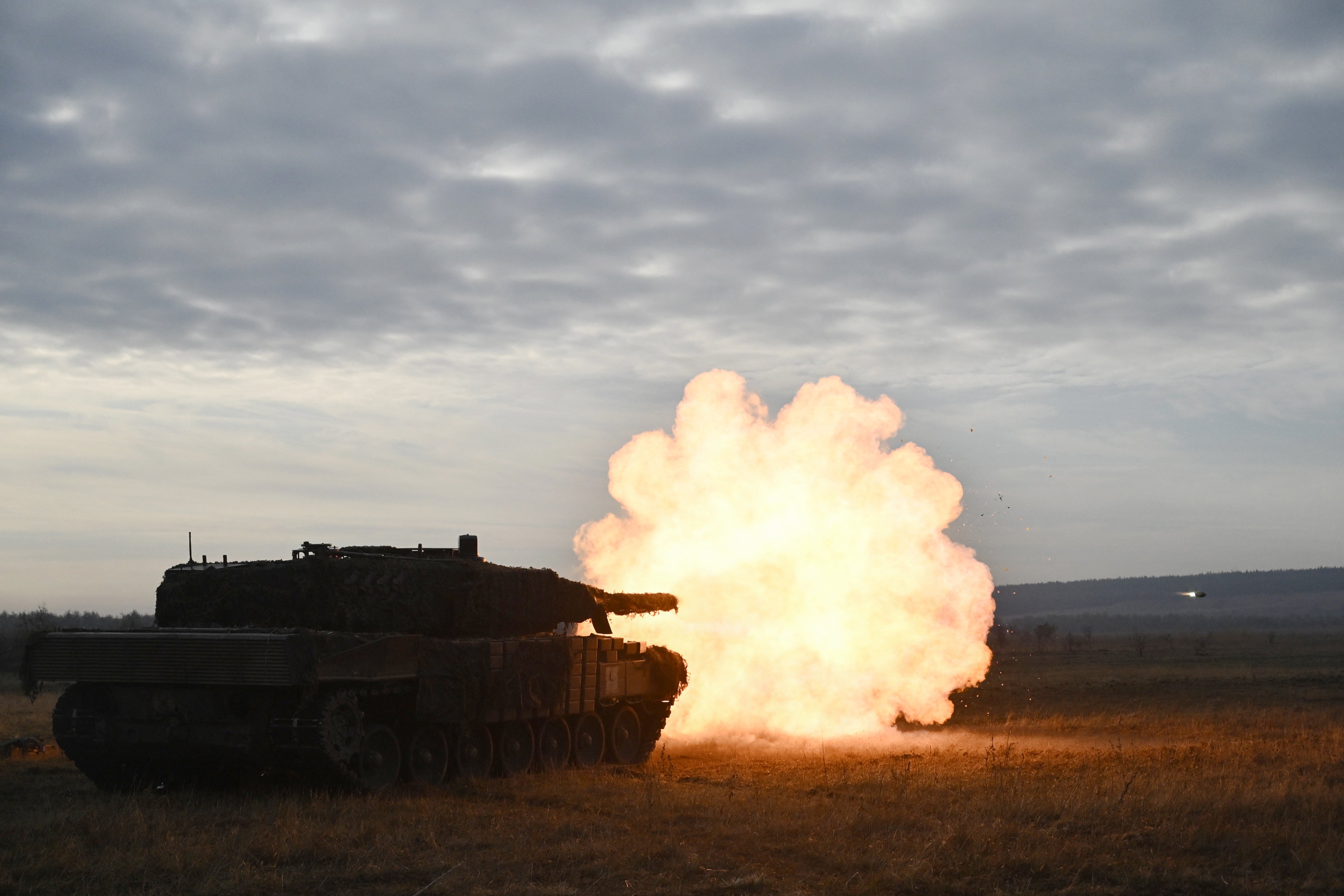 Ukrainian ground forces fire a Leopard 2A4 tank during field training