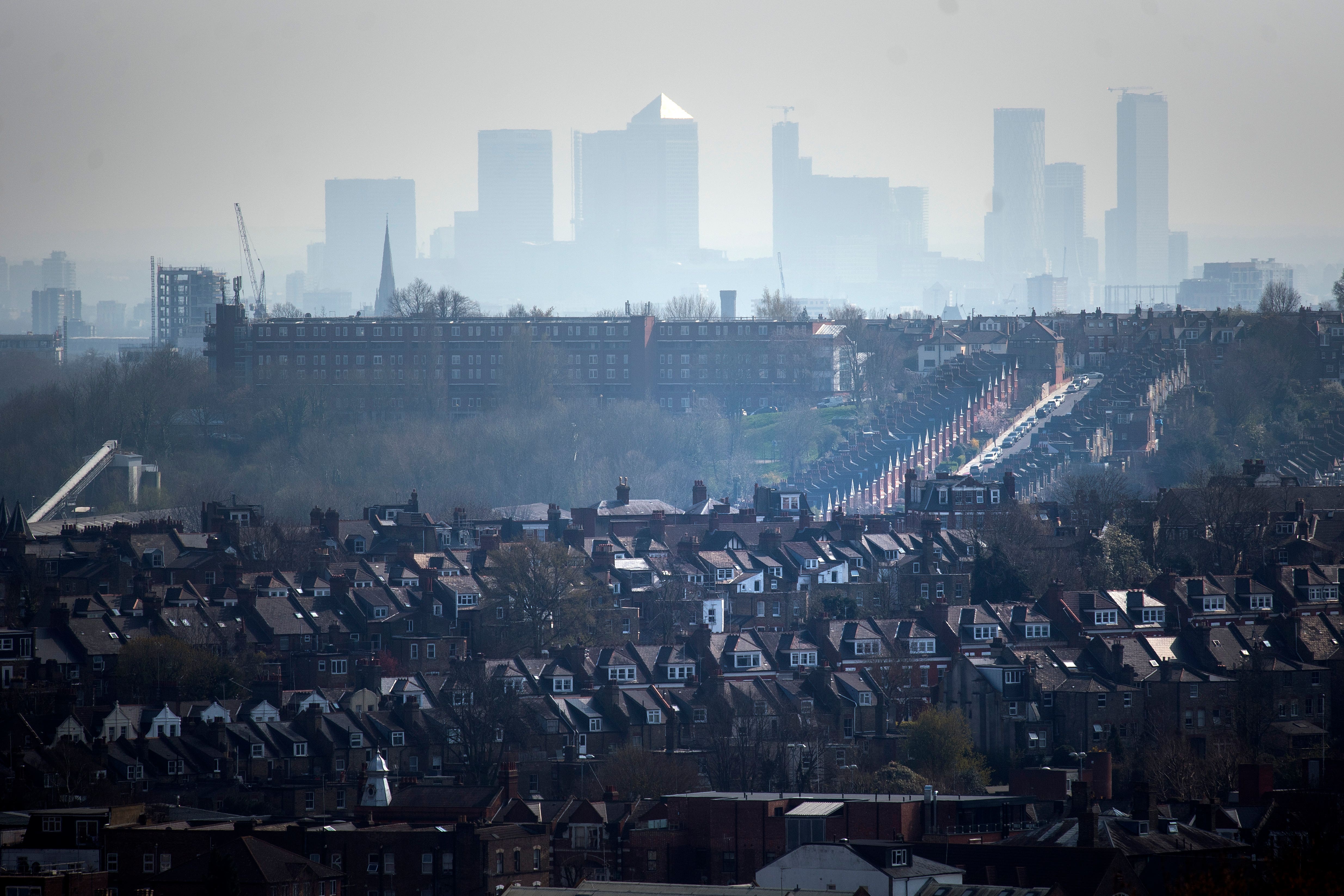 The Canary Wharf skyline viewed through the haze from Alexandra Palace, north London (Victoria Jones/PA)