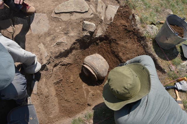 <p>Researchers excavate medieval pottery at the newly rediscovered medieval Silk Road city Tugunbulak in 2022</p>