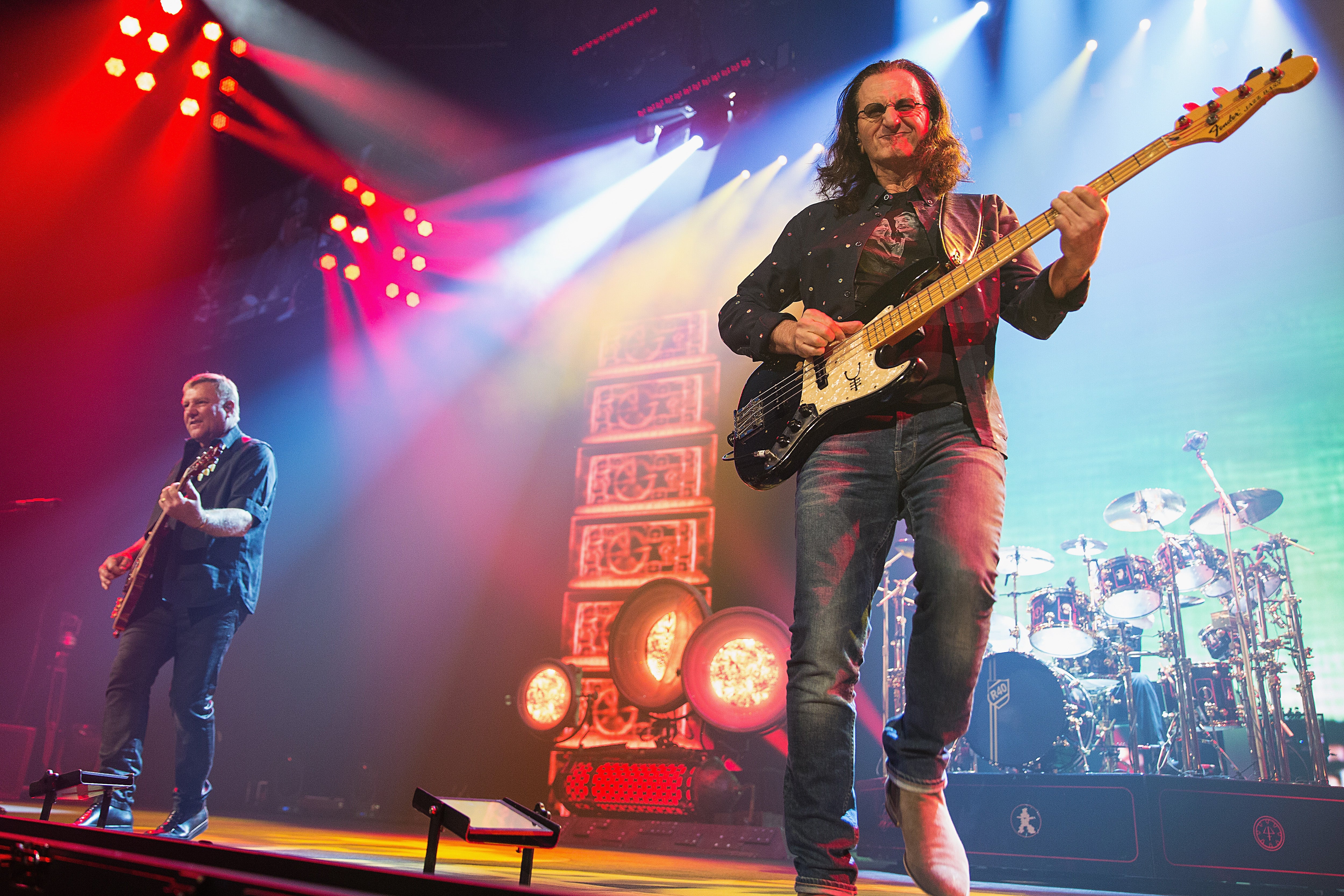 Alex Lifeson, Geddy Lee and Neil Peart of Rush on stage during the R40 LIVE tour at KeyArena on 19 July 2015 in Seattle, Washington