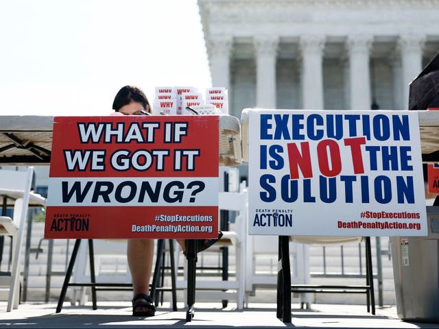 <p>Activists from the Abolitionist Action Committee stand outside of the US Supreme Court building in July </p>