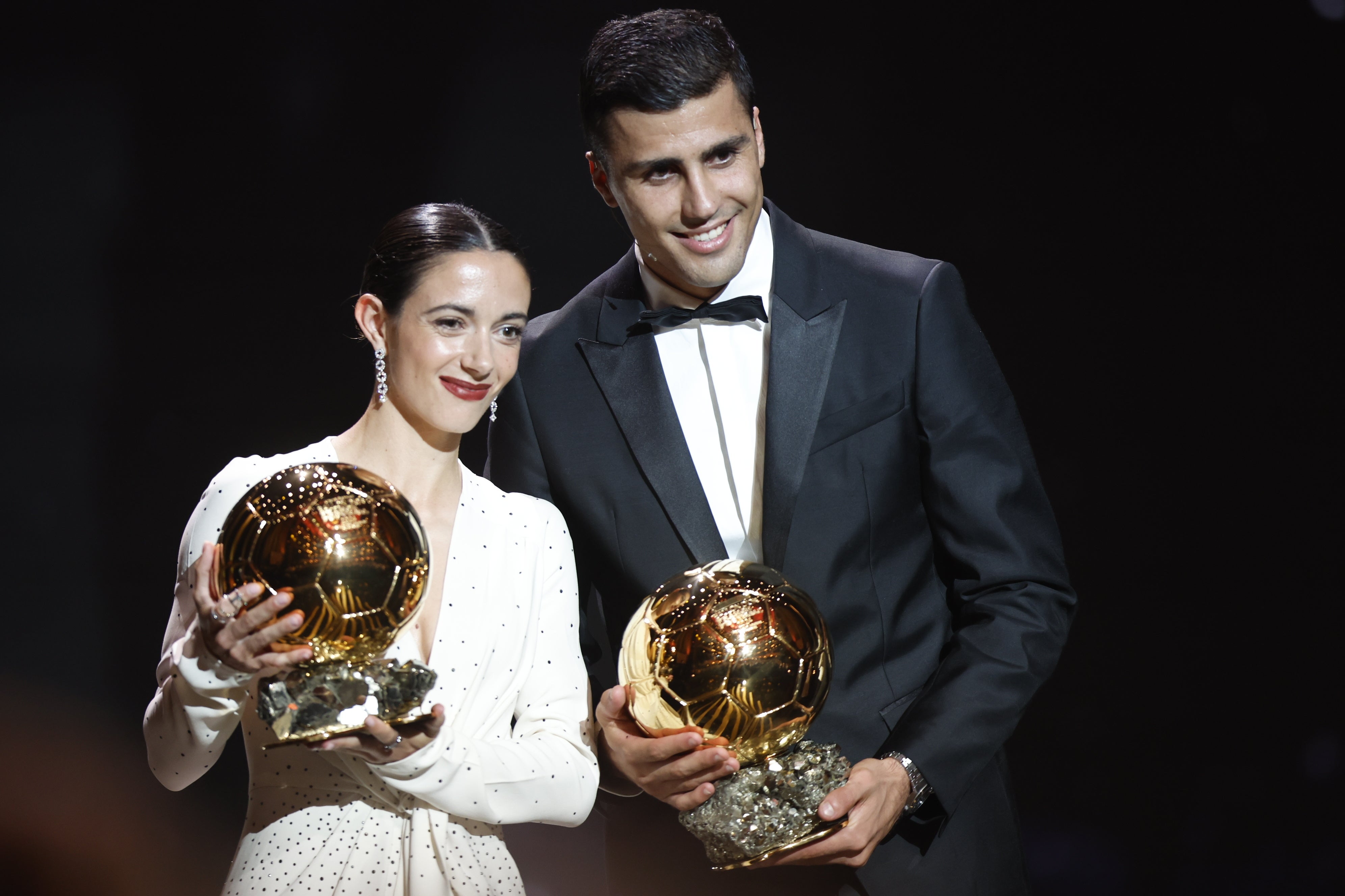 Aitana Bonmati and Rodri pose with their trophies