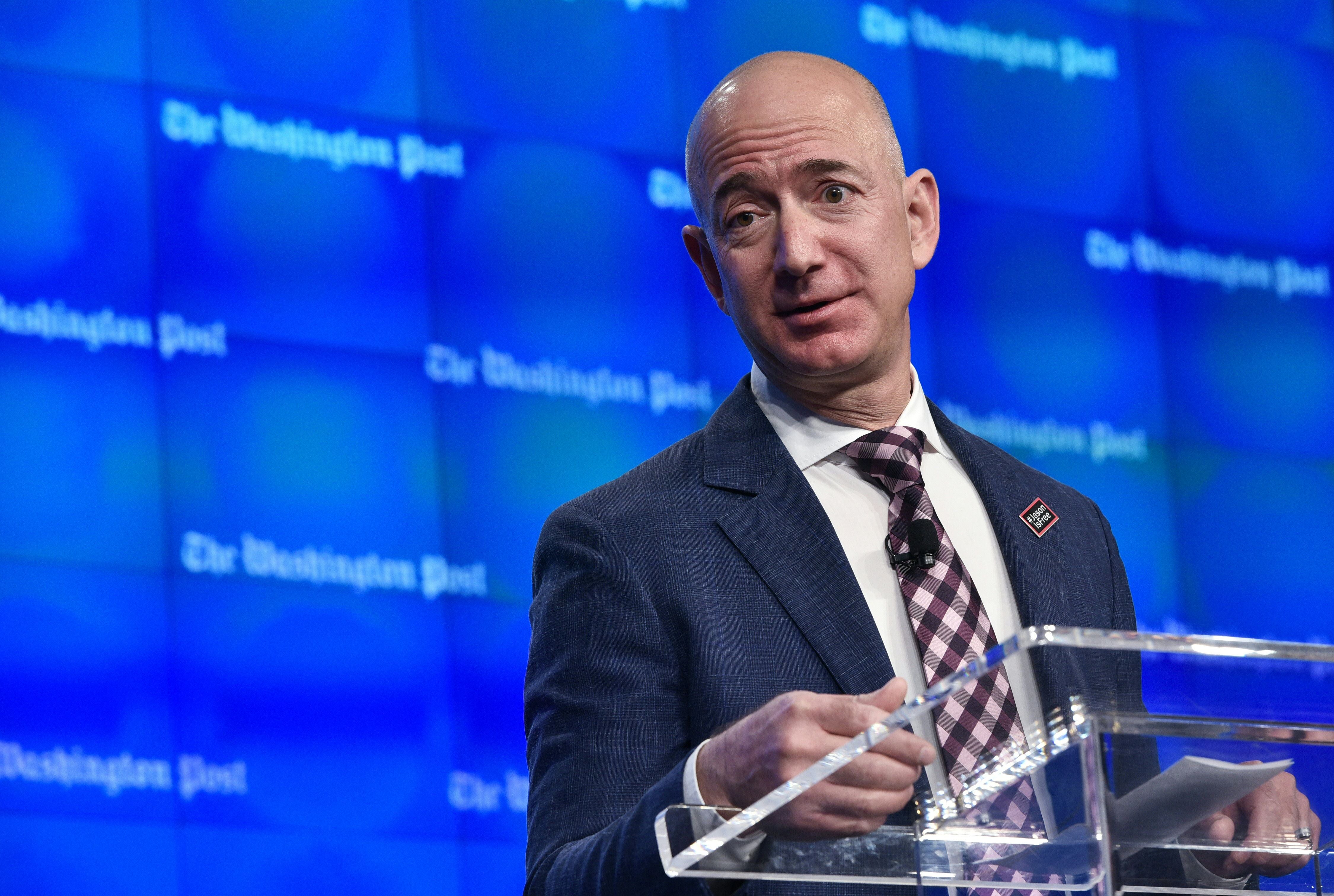 Washington Post owner Jeff Bezos, pictured speaking at its D.C. headquarters in 2016, attended Trump’s inauguration last month