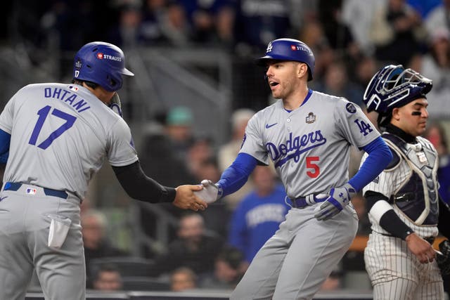 <p>Shohei Ohtani celebrated with Freddie Freeman after the latter’s home run helped put the LA Dodgers a game away from World Series glory </p>