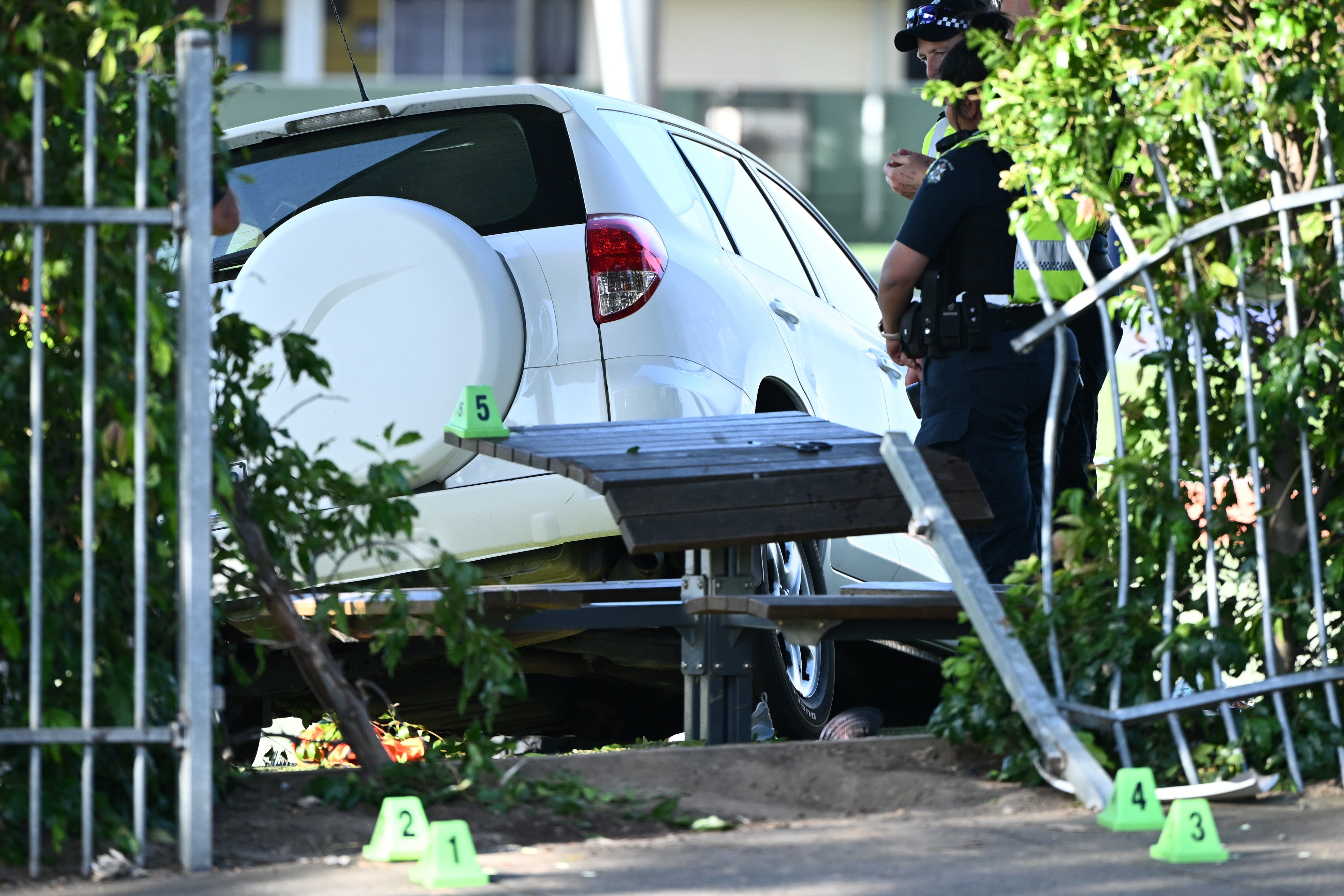 Victoria police inspect the scene where a car crashed through a fence at Auburn South Primary School, Tooronga Road, Hawthorn East, in Melbourne, Australia, 29 October 2024