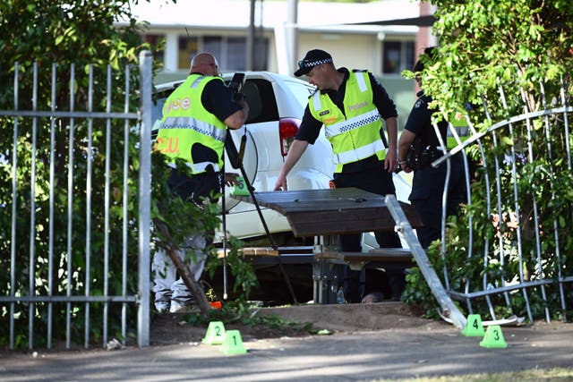 <p>Victoria police inspect the scene where a car crashed through a fence at Auburn South Primary School, Tooronga Road, Hawthorn East, in Melbourne, Australia, 29 October 2024</p>