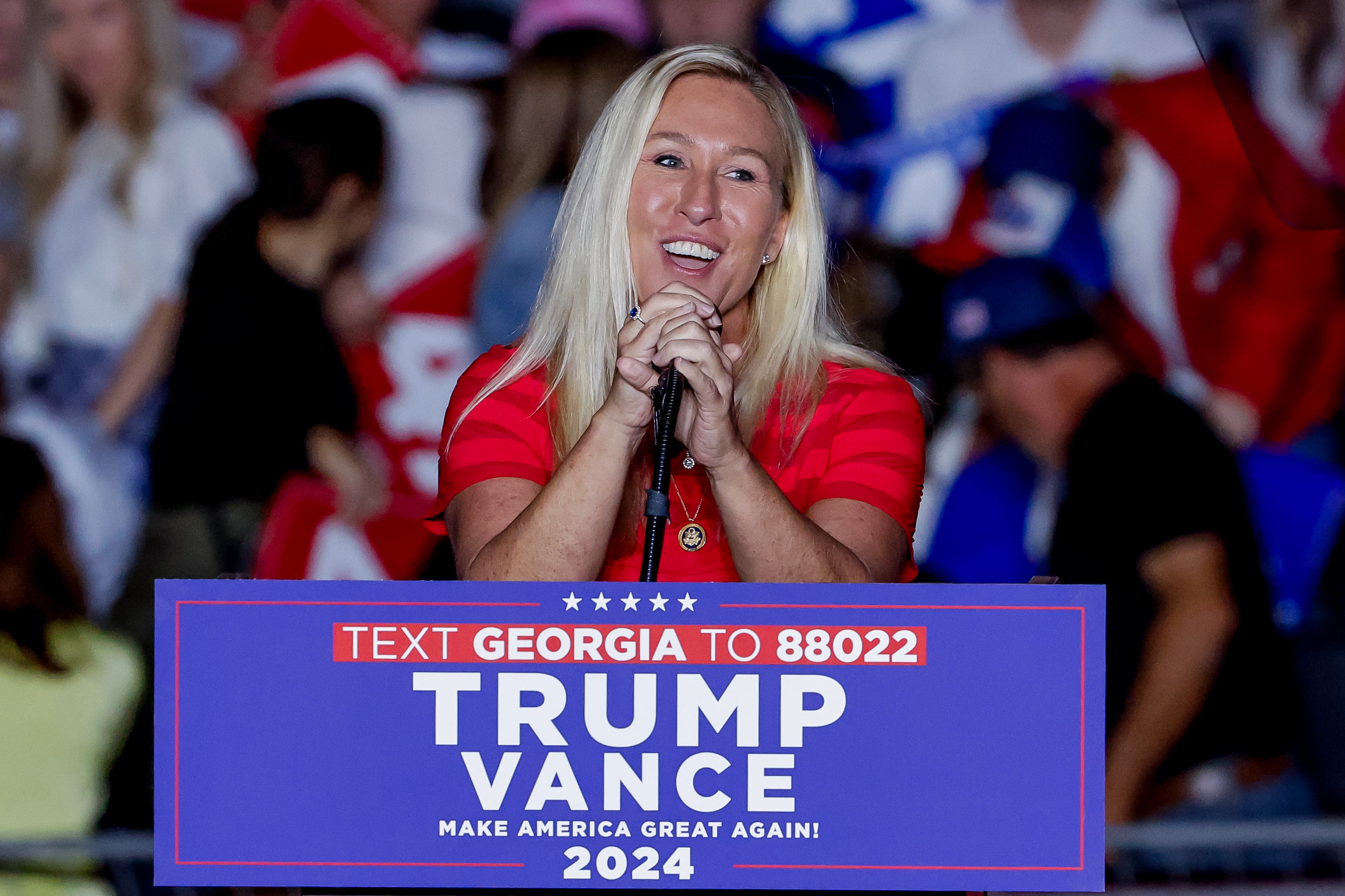 Georgia Representative Marjorie Taylor Greene introduces Trump in Atlanta on Monday. He then went on to imagine her being blown up in a hydrogen car explosion