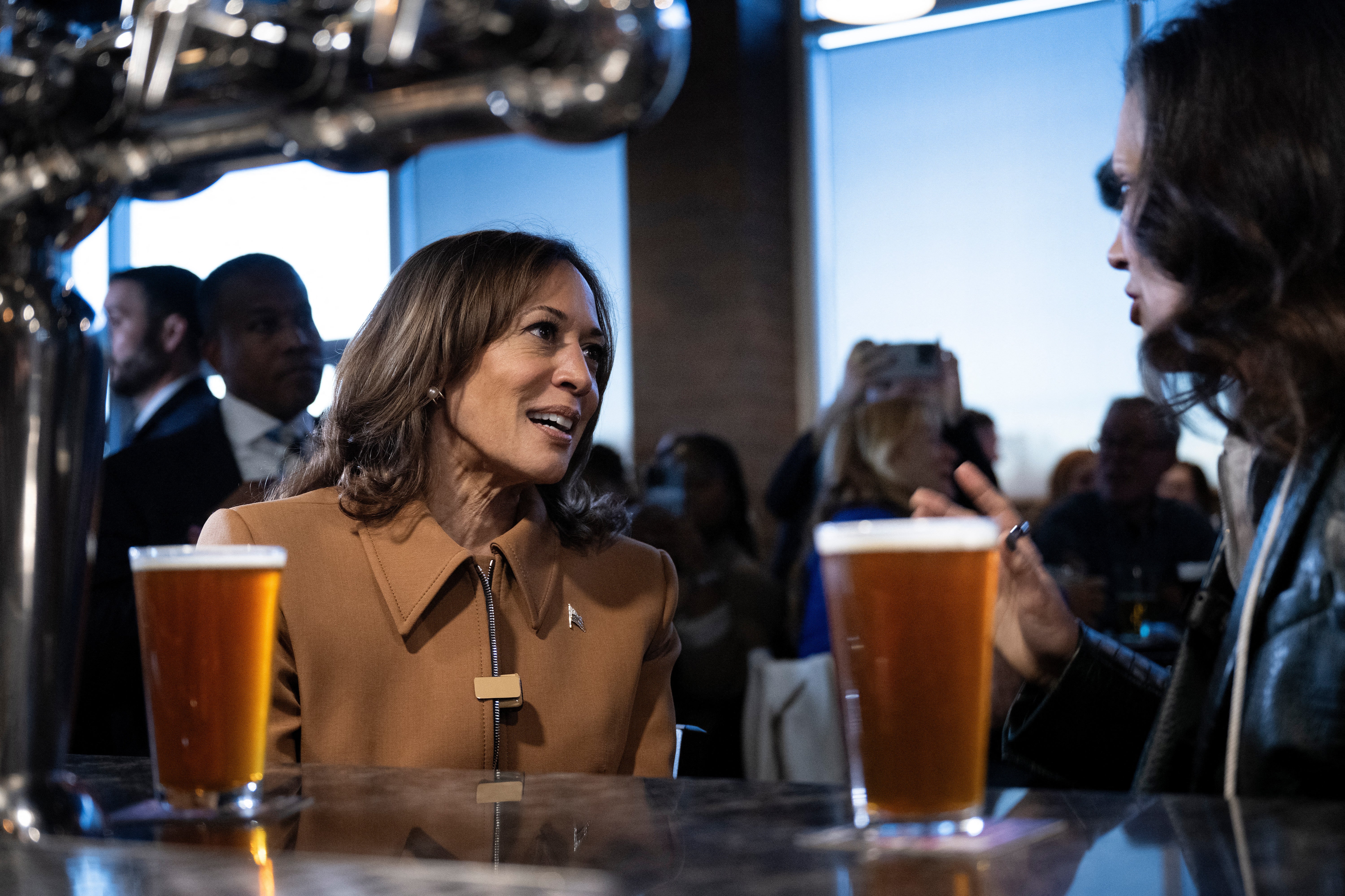 Harris and Whitmer stop at the Trak Houz Bar and Grill on October 26, 2024, in Kalamazoo, Michigan