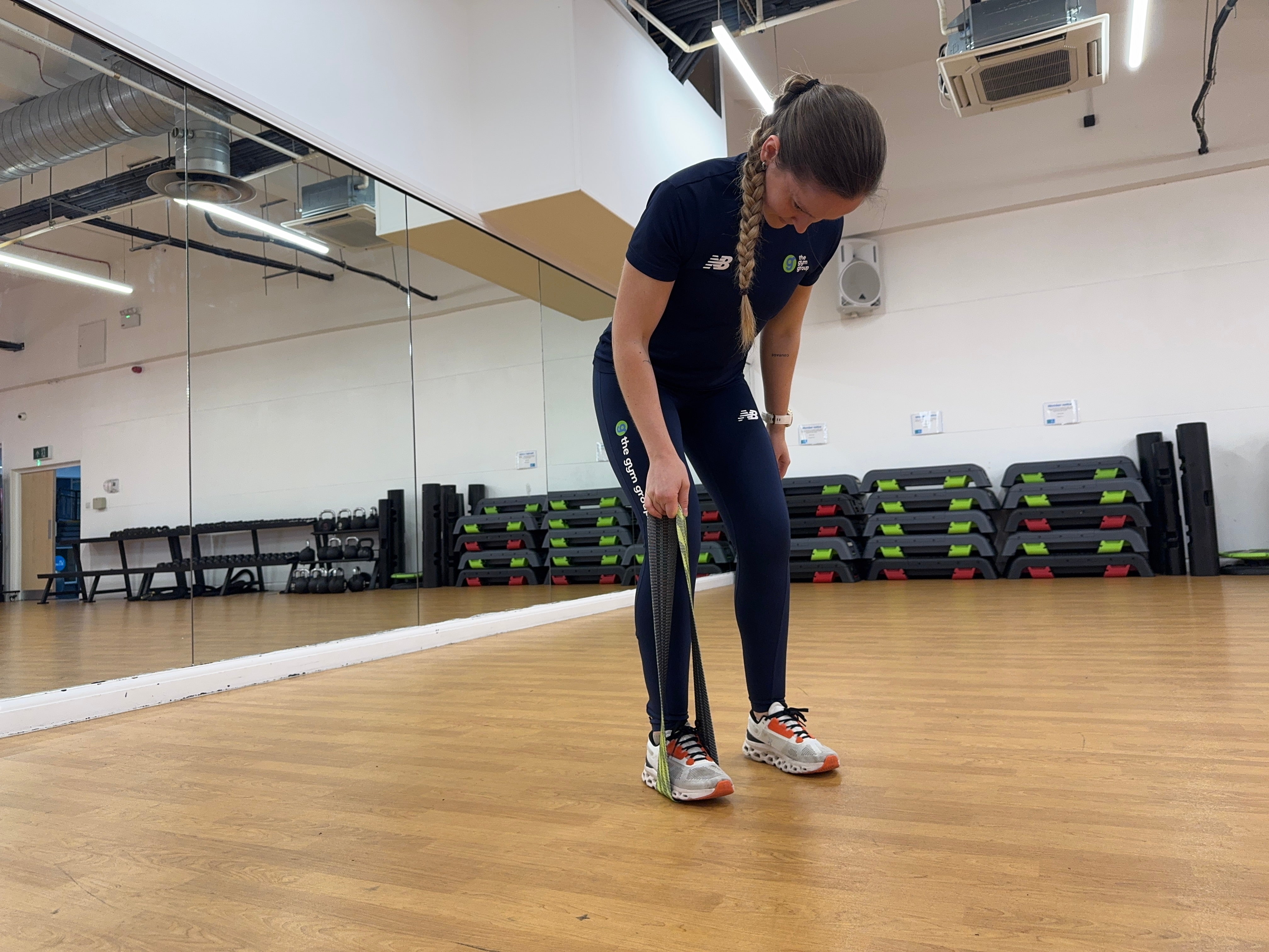 Trainer Sasha Bridgen demonstrating a banded bent-over row