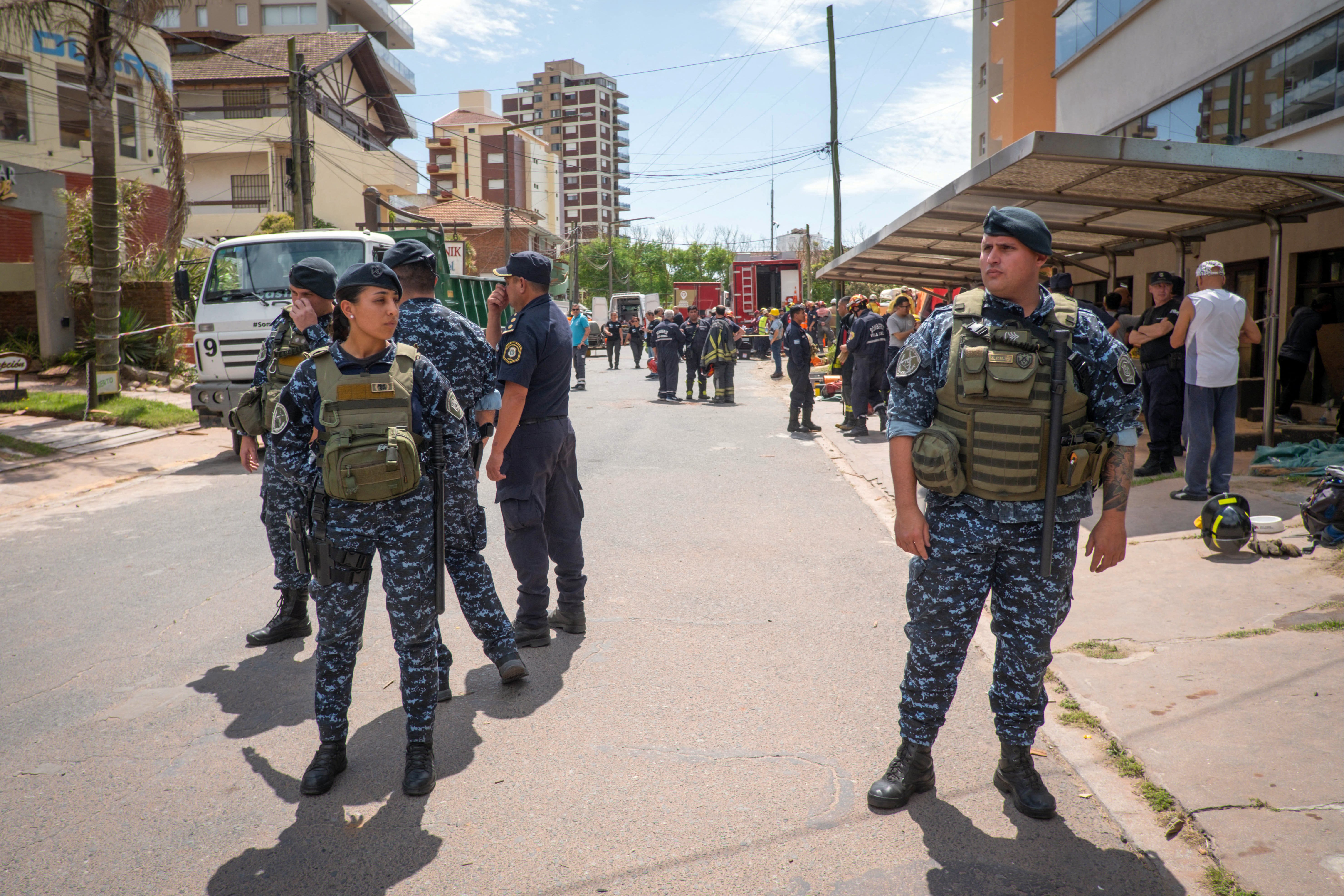 Police and firefighters work after the collapse of the Dubrovnik Hotel