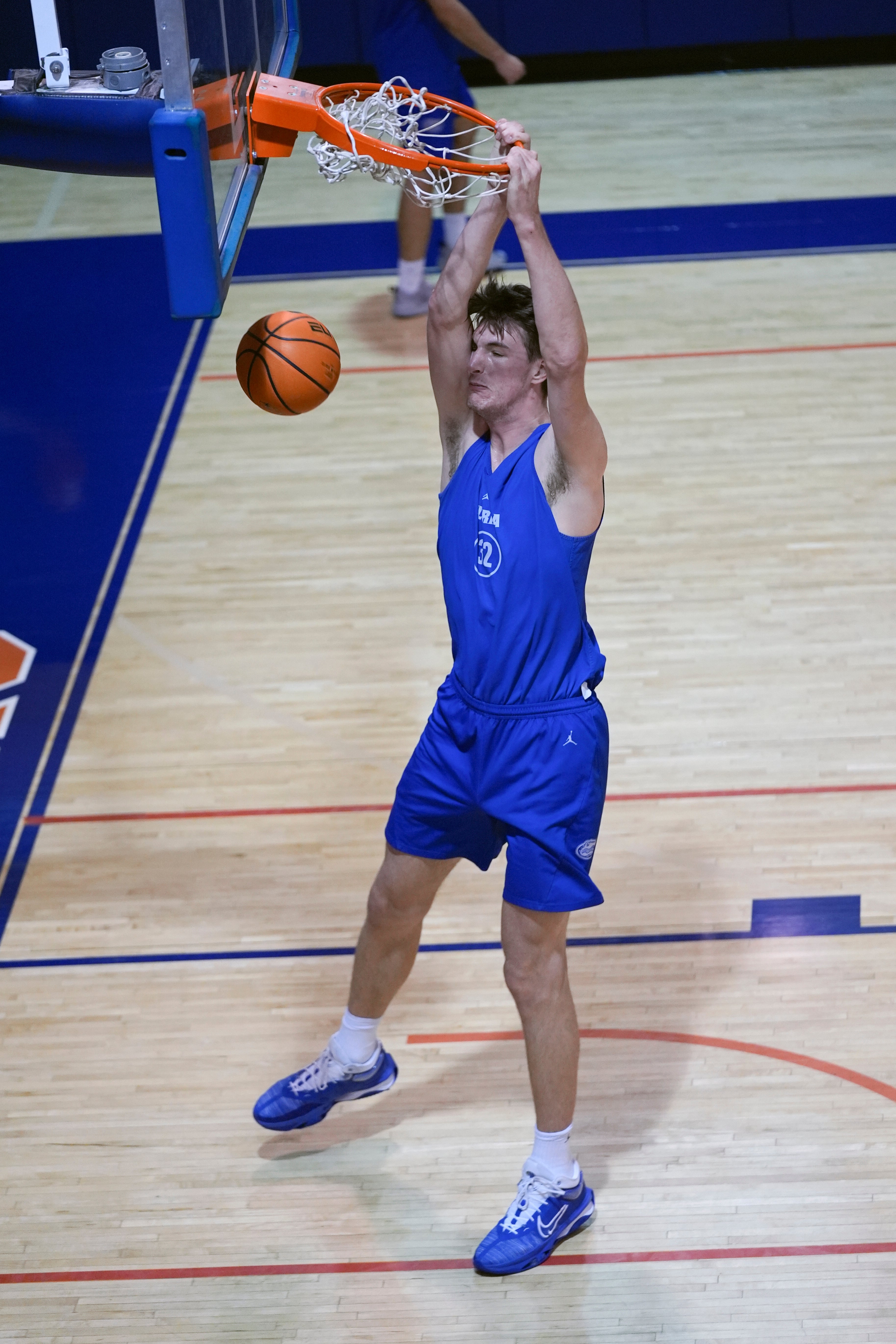 Olivier Rioux, a 7-foot-9 NCAA college basketball player at Florida, dunks the ball