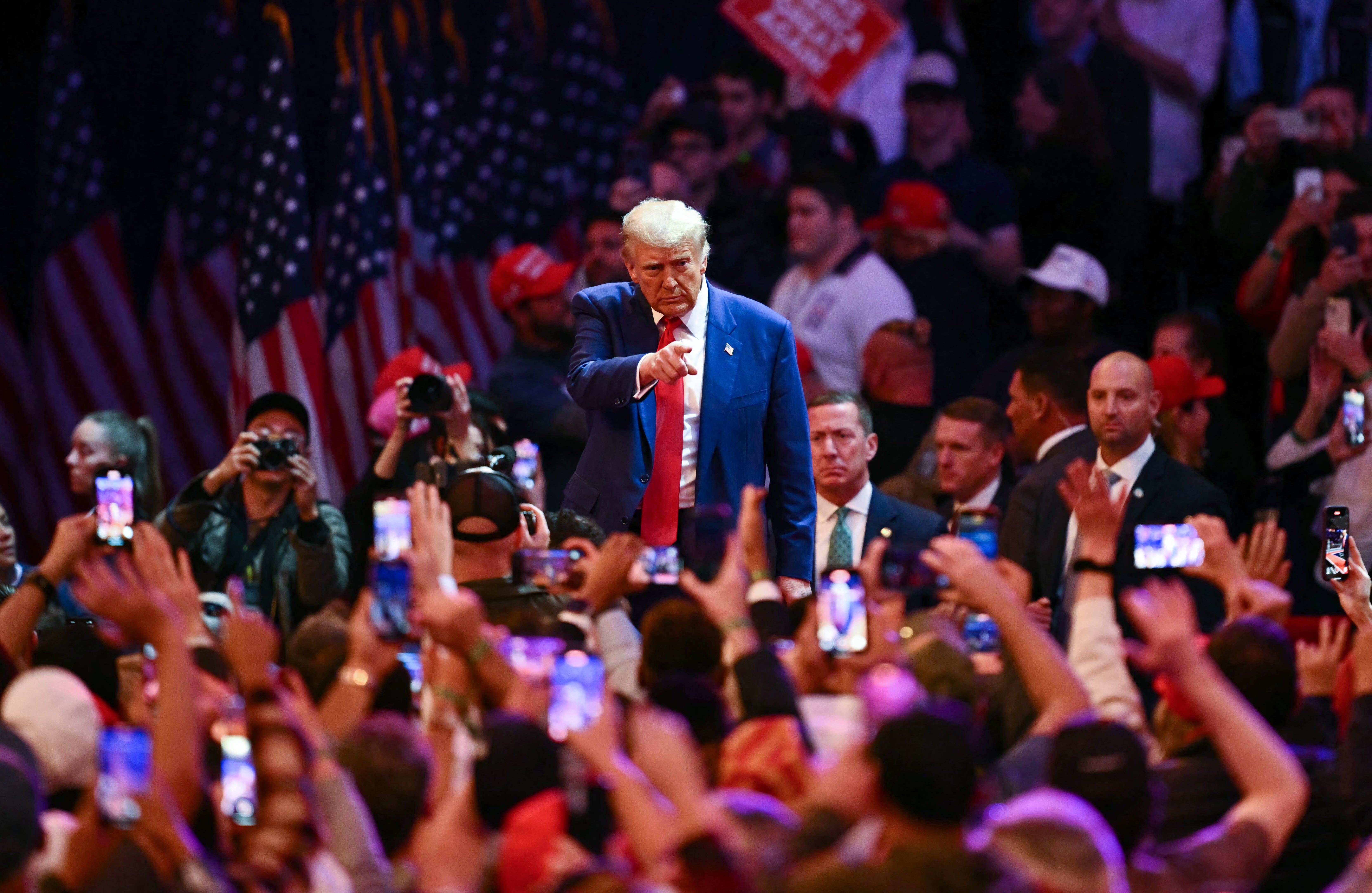 Donald Trump points to supporters after speaking at Madison Square Garden on October 27.