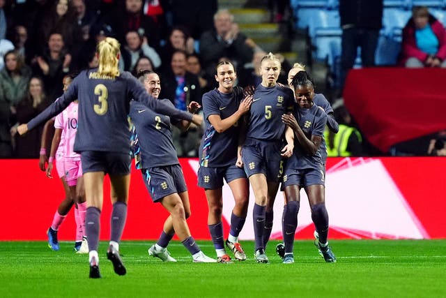 <p>Leah Williamson, second right, celebrates the opener on her 50th cap</p>