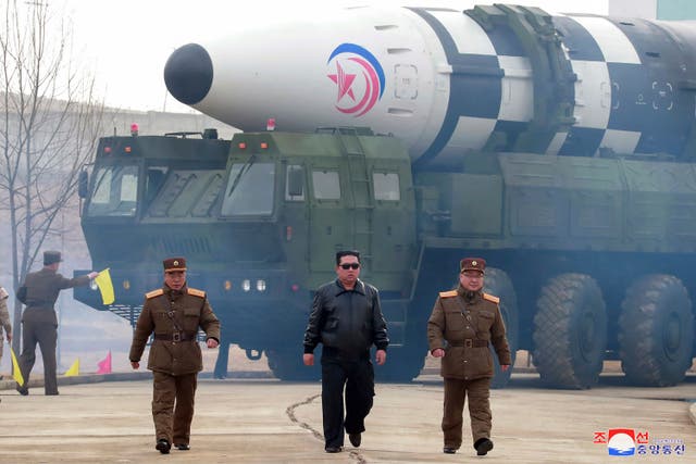 <p>North Korean leader Kim Jong-un,  walks around what is said to be a Hwasong-17 intercontinental ballistic missile (ICBM) on the launcher at an undisclosed location in North Korea on 24 March 2022</p>