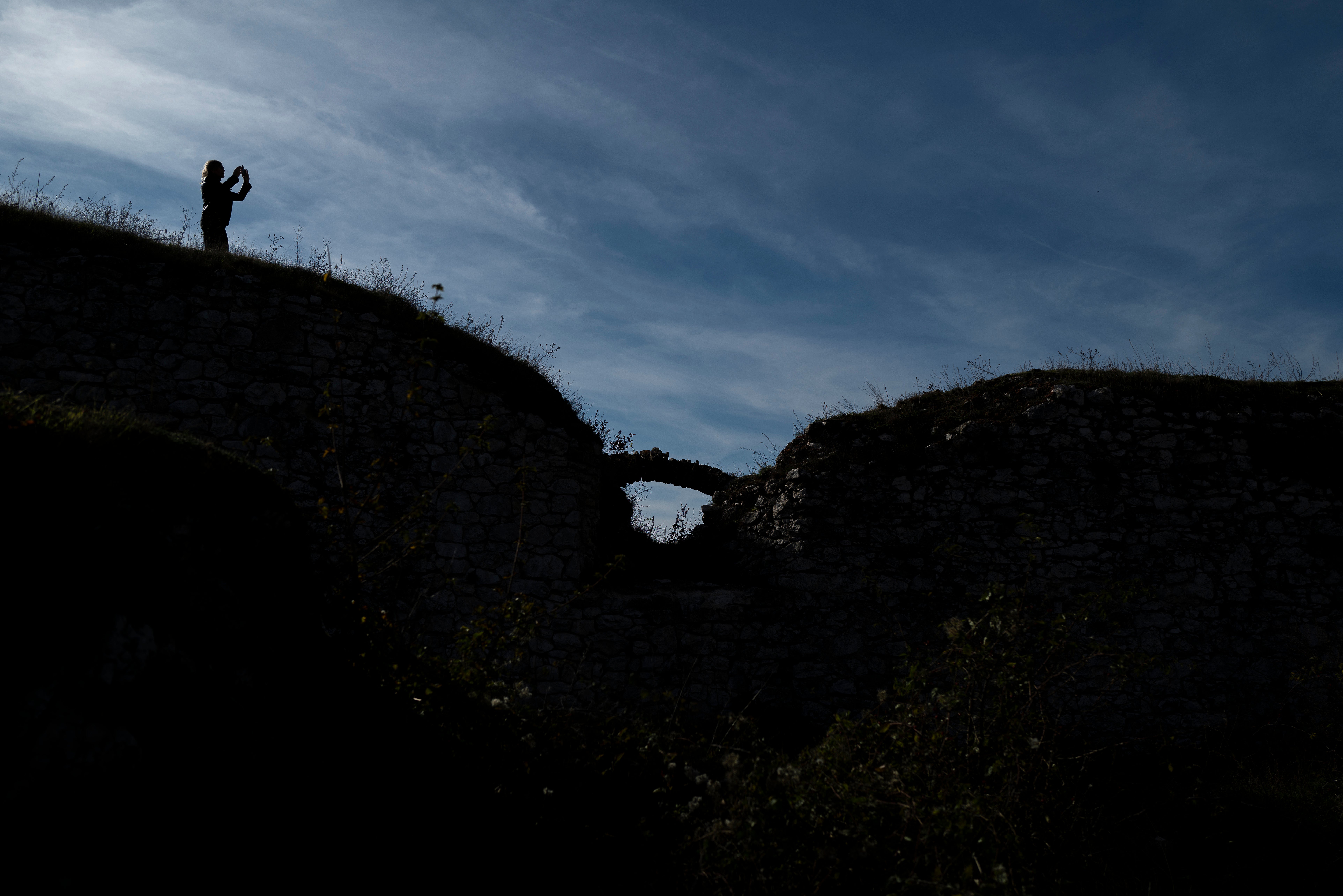 People walk around the ruins of the former Bathory castle near Cachtice, Slovakia