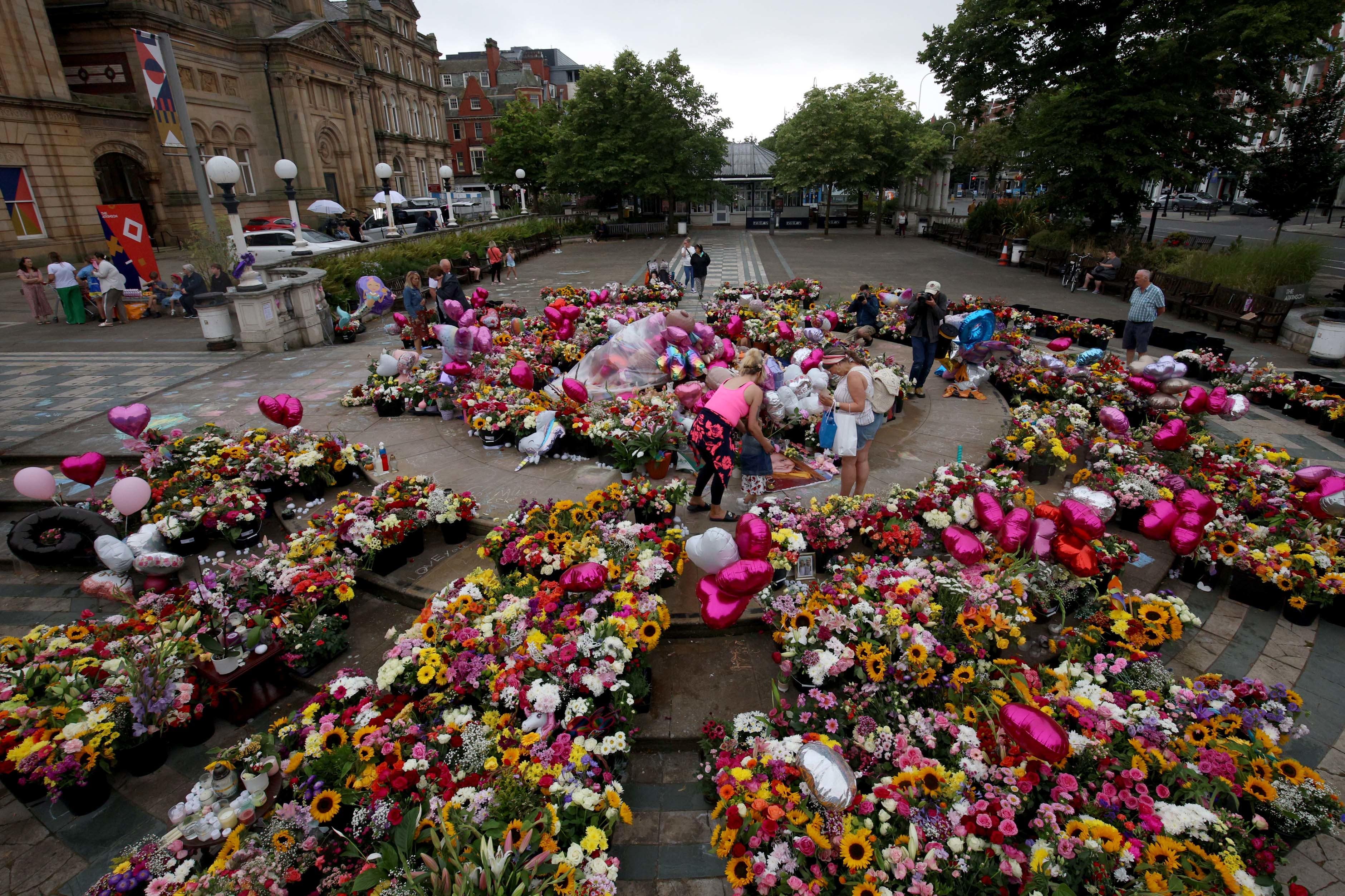 Floral tributes left outside the Town Hall in Southport in the days after the attack that saw three girls lose their lives (Ryan Jenkinson/PA)