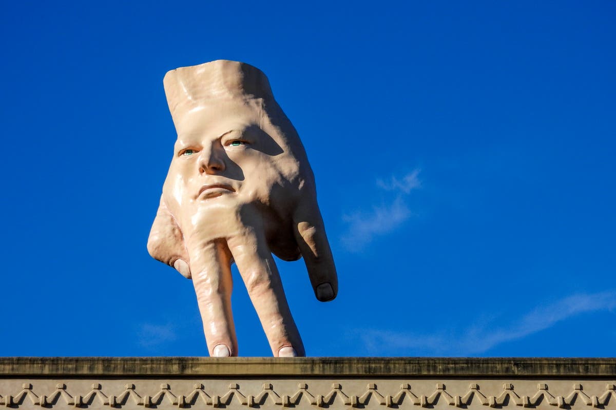 A New Zealand city waves goodbye to its giant hand sculpture that many came to love