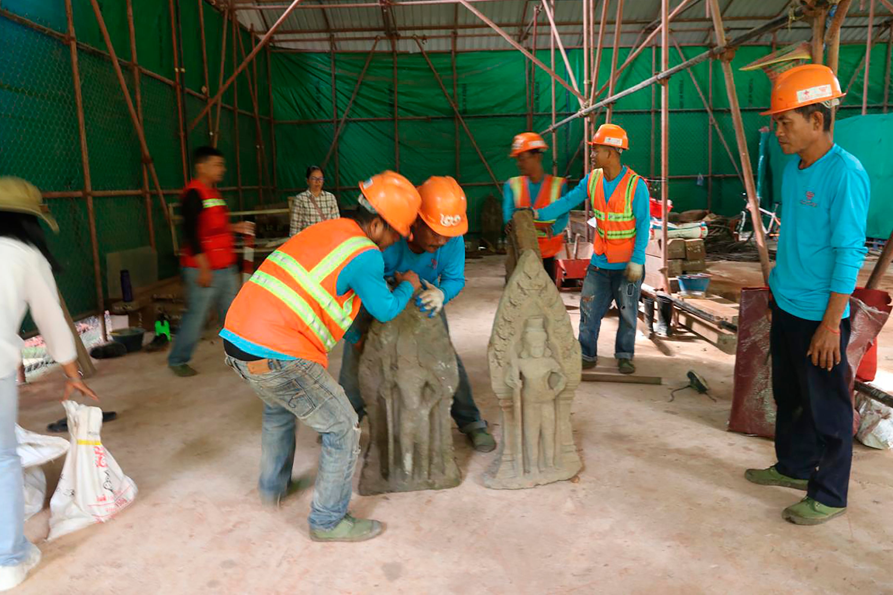 A photo provided by Apsaras National Authority shows centuries-old sandstone statues being arranged at Angkor Thom in Cambodia, Oct. 24, 2024