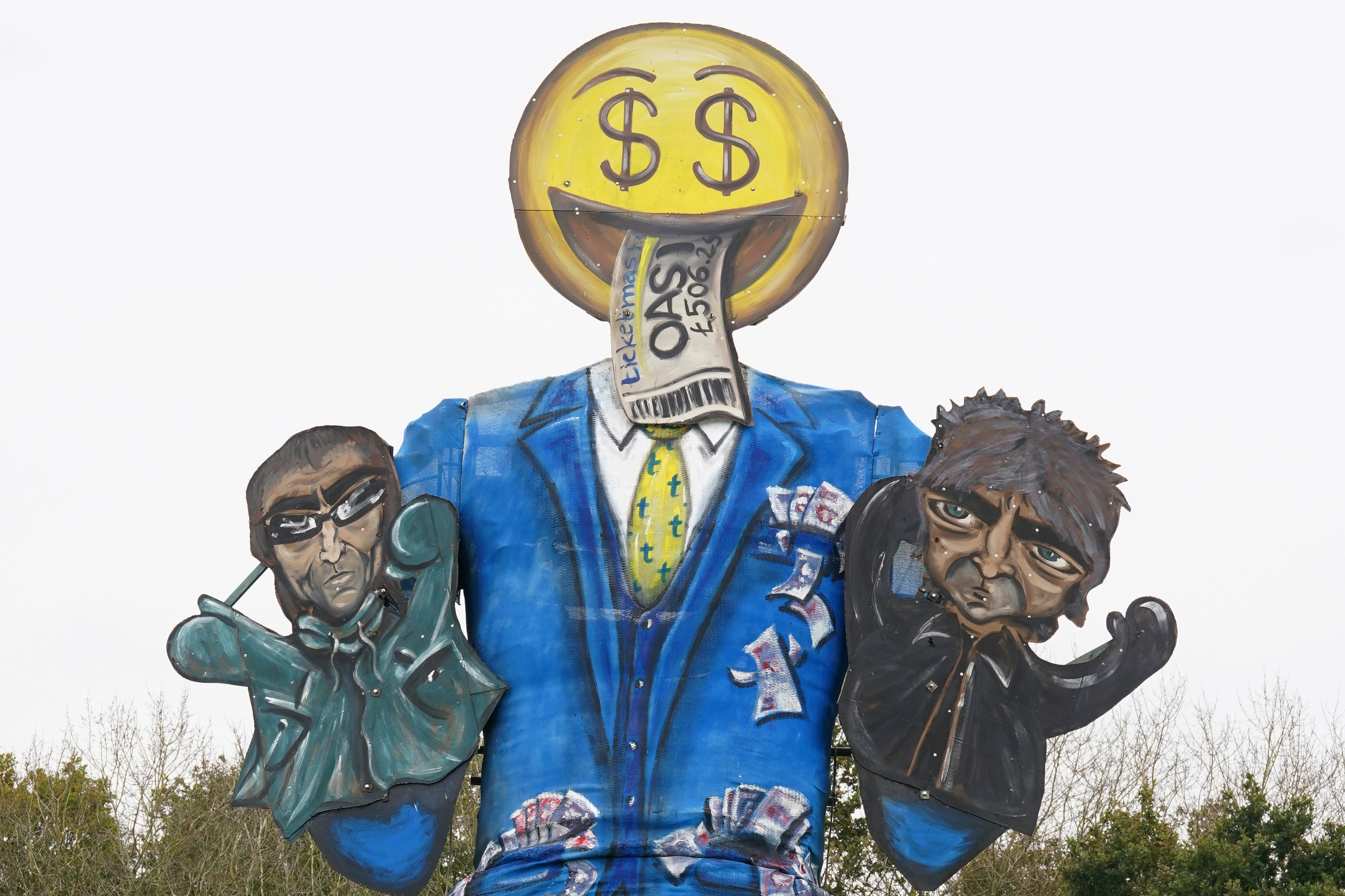 Members of the Edenbridge Bonfire Society unveil their guy for 2024, which is a depiction of ticket-selling platform Ticketmaster, featuring Noel and Liam Gallagher, at Breezehurst Farm Industrial Park, Edenbridge, Kent (Gareth Fuller/PA)