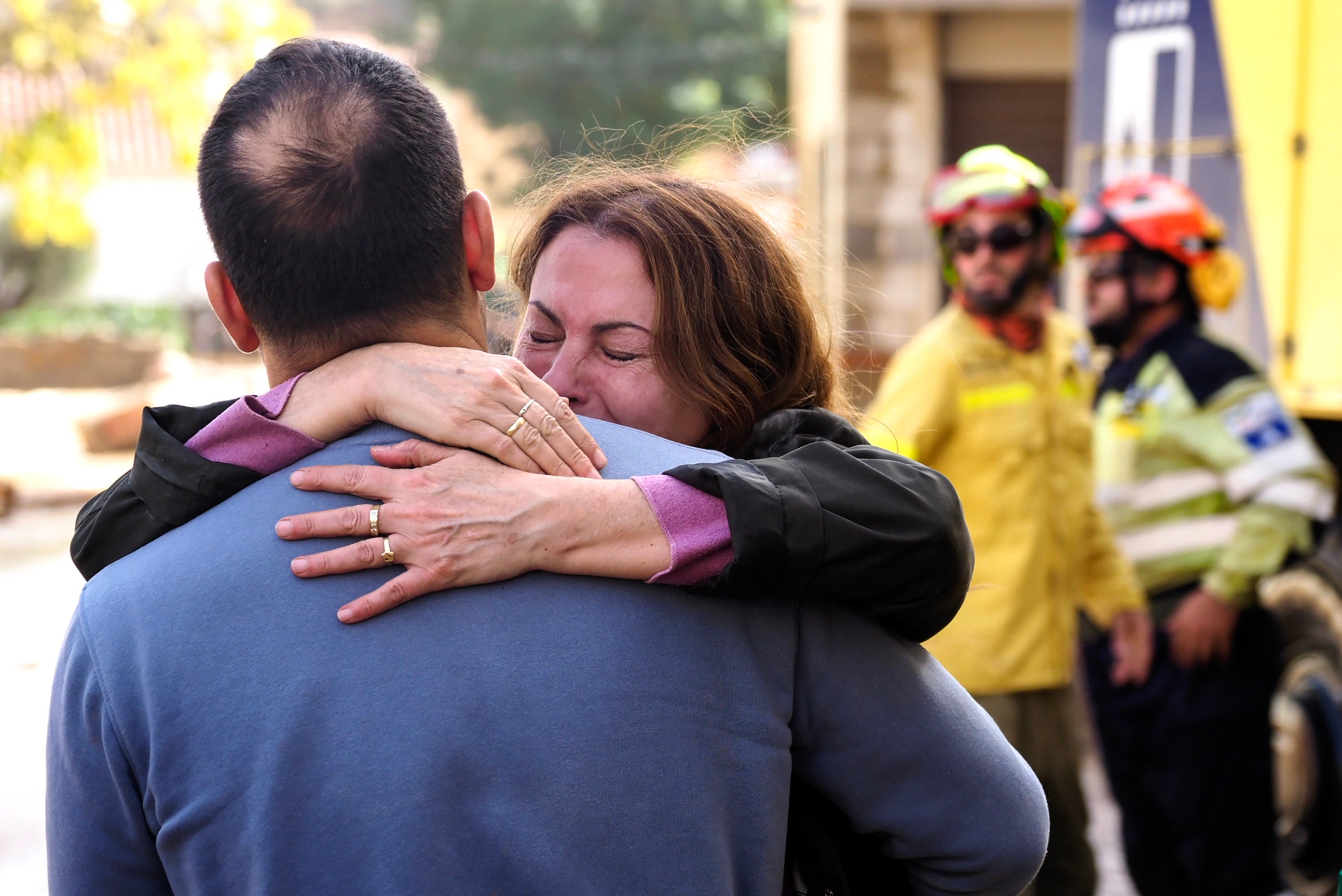 Residents react in the flood-affected municipality of Mira in Cuenca province, Spain