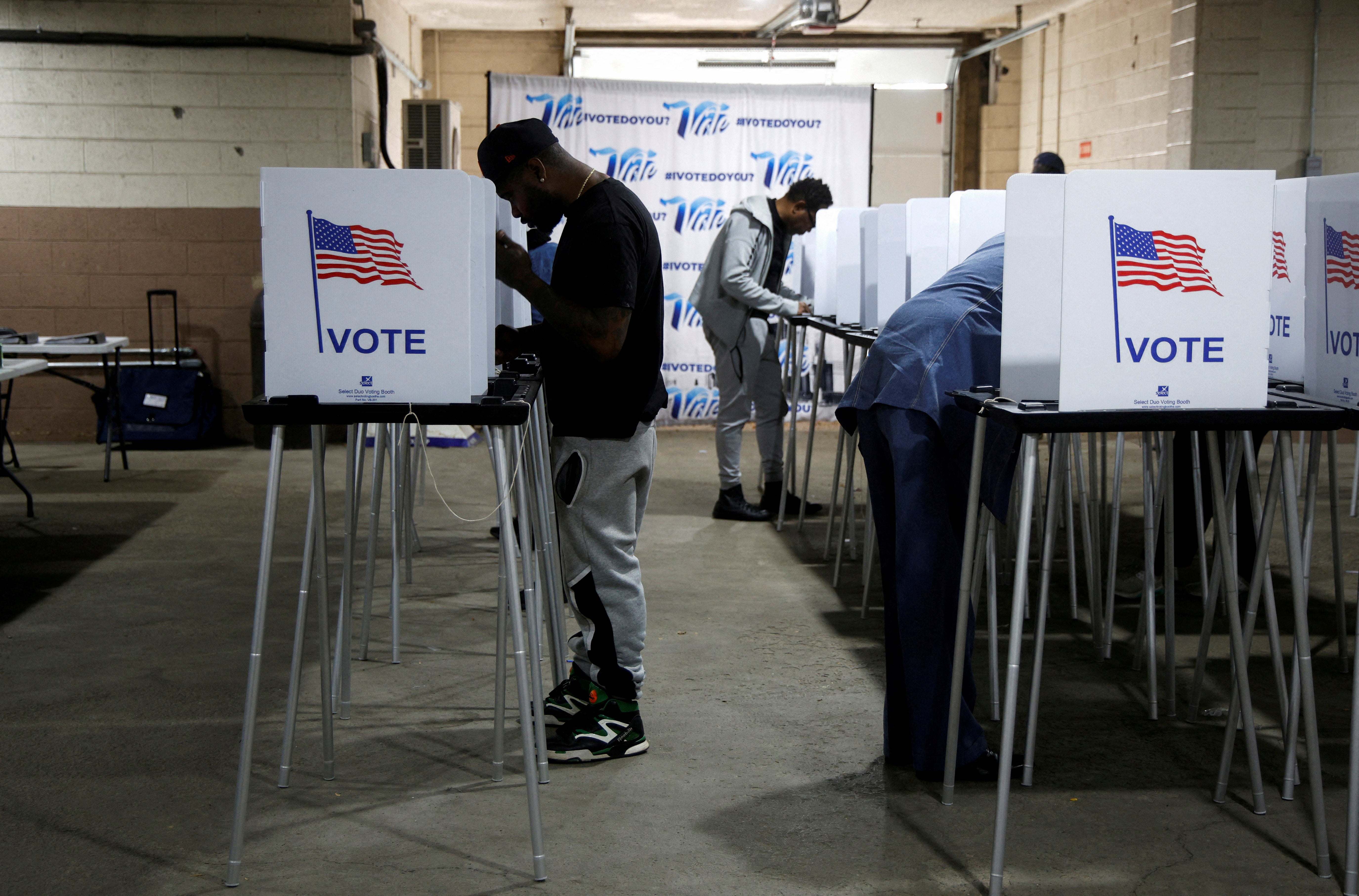 Voters fill out ballots for the presidential election in Detroit on Monday. The Great Lakes region could see showers on Election Day, which could help decrease turnout