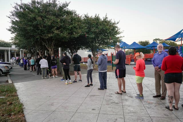 <p>People wait in line for early voting in Houston last week. Texas is one of several states that could see significant rain and flooding through Election Day</p>