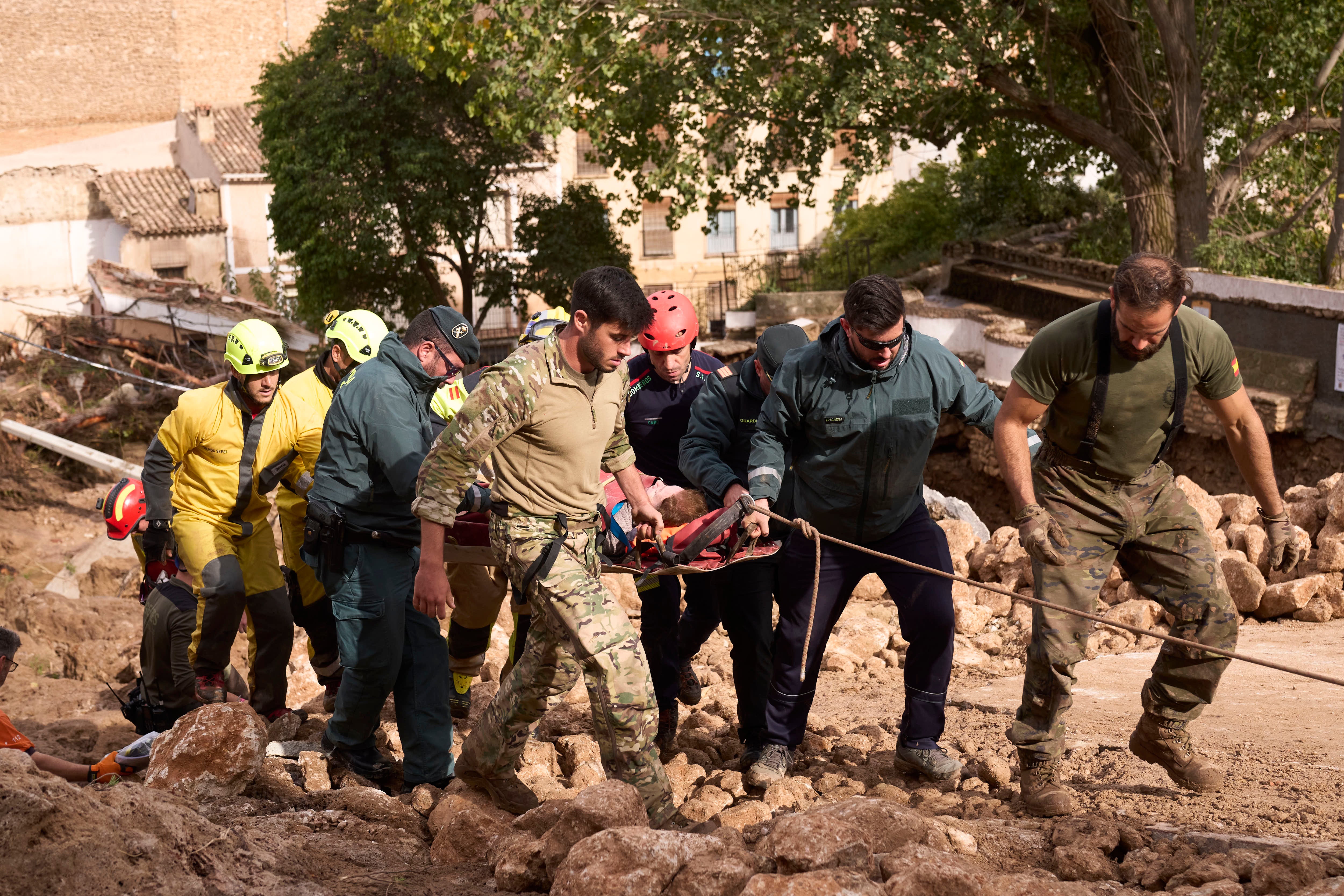 Emergency workers carry an injured person in Letur