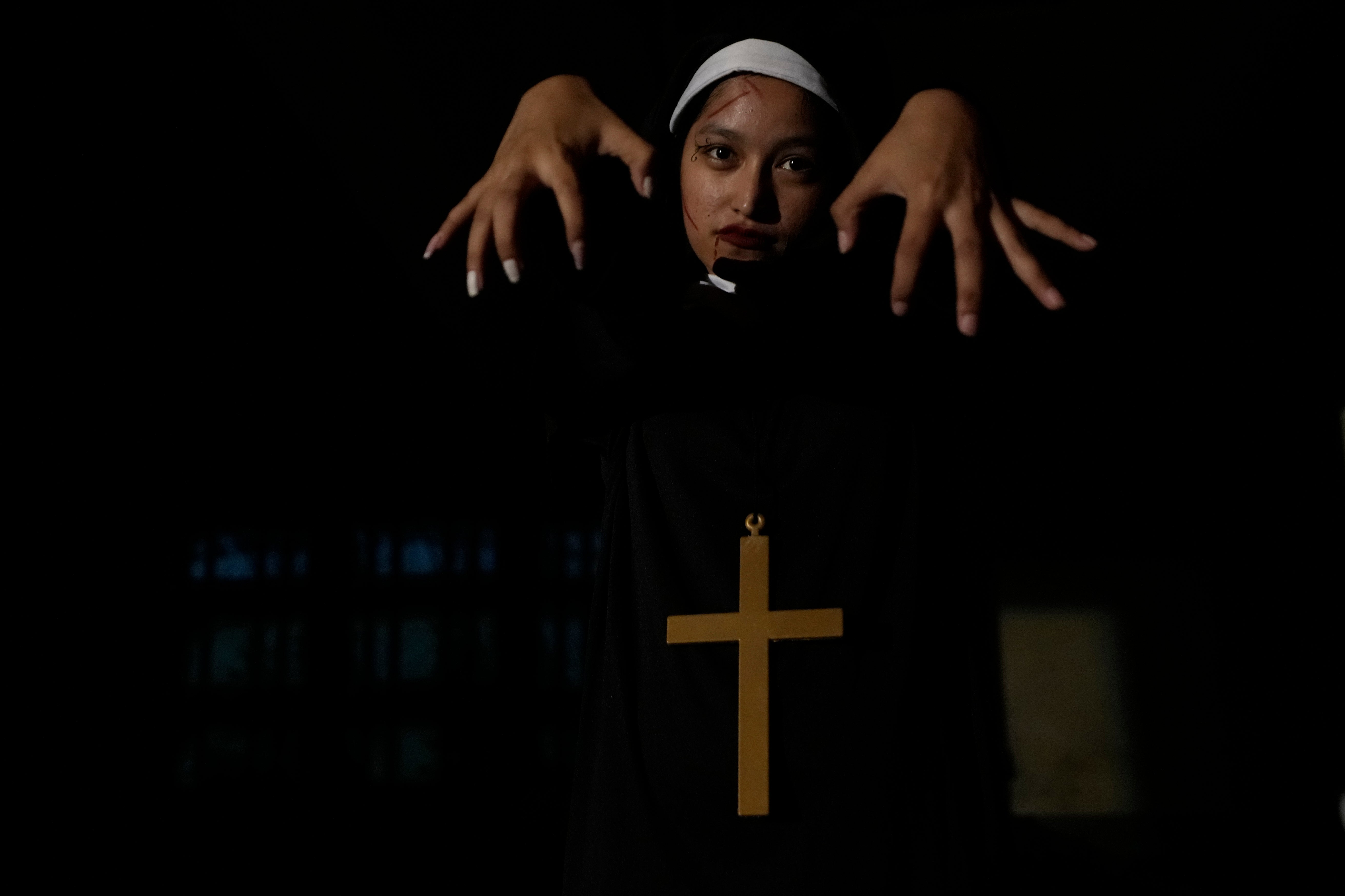 A visitor dressed in a ghost costume at Goosebump market as a part of Halloween festival in Bangkok