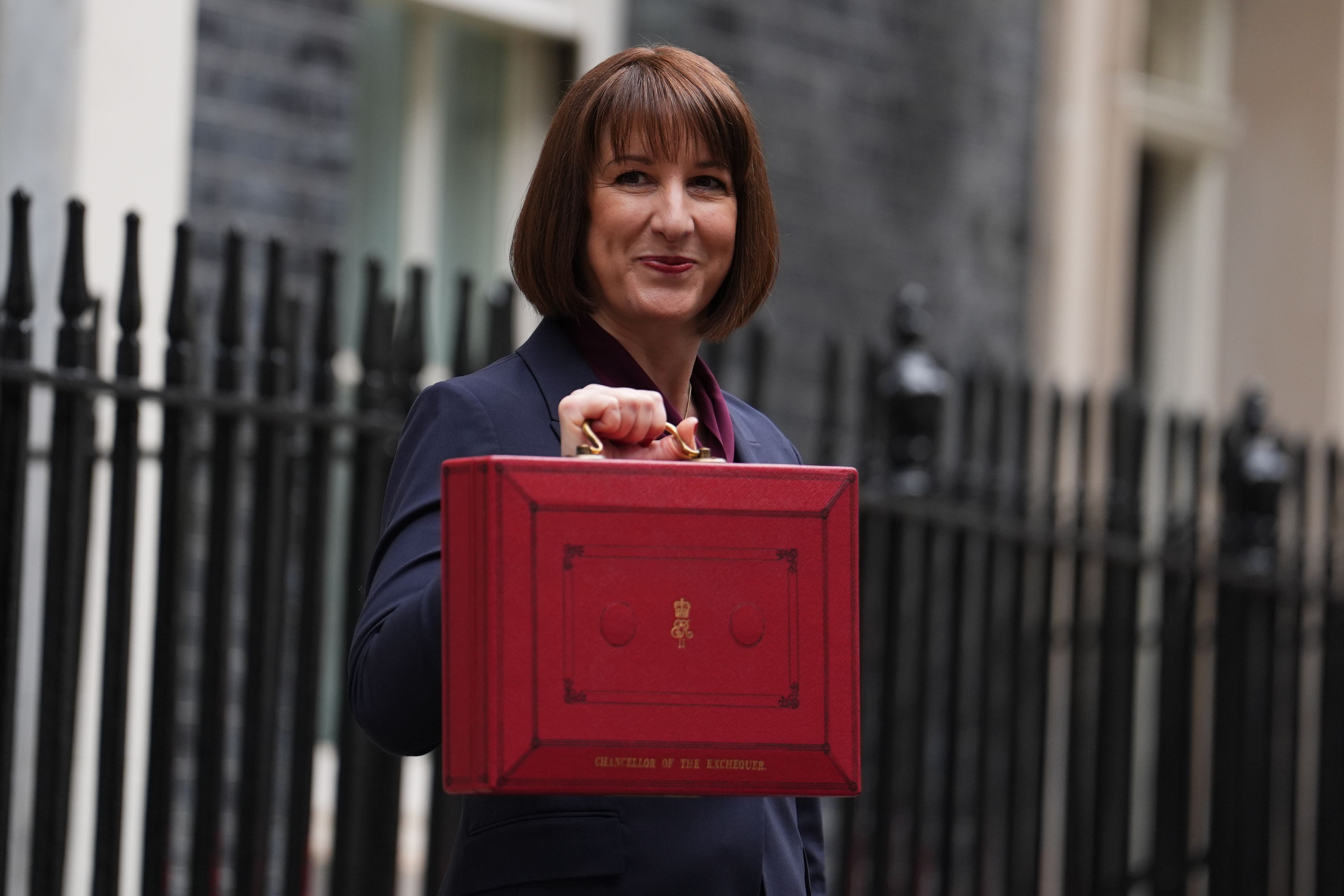 Chancellor Rachel Reeves leaves 11 Downing Street with her ministerial red box before delivering her Budget in the Houses of Parliament (Jordan Pettitt/PA)