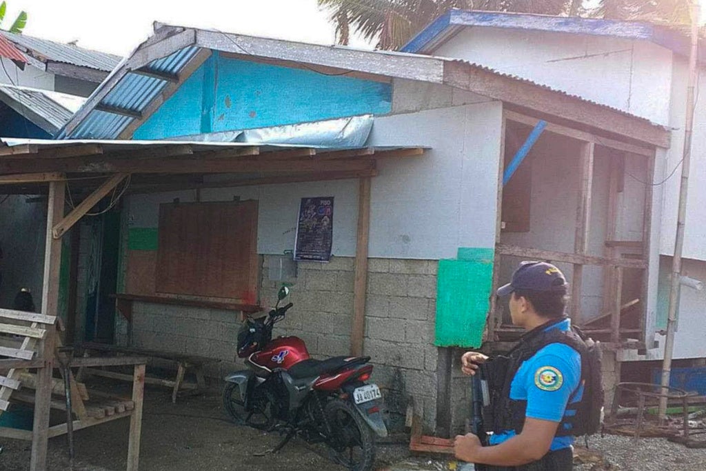 In this photo provided by the Philippine National Police Regional Office 9, a policeman checks an area Friday Oct. 18, 2024, where an American identified as Elliot Onil Eastman, from Vermont, was reportedly abducted by gunmen in Sibuco town, Zamboanga del Norte province, southern Philippines