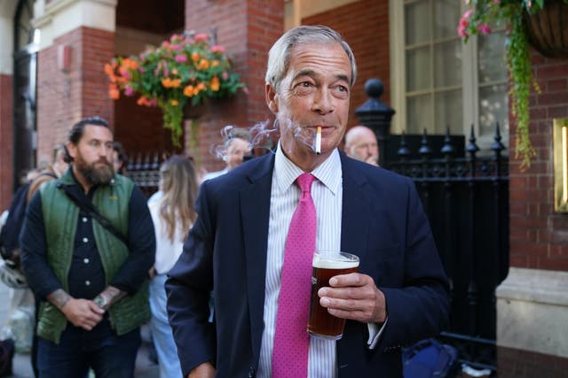 Nigel Farage claimed the Budget would save him more than £1 per week on beer (Stefan Rousseau/PA)