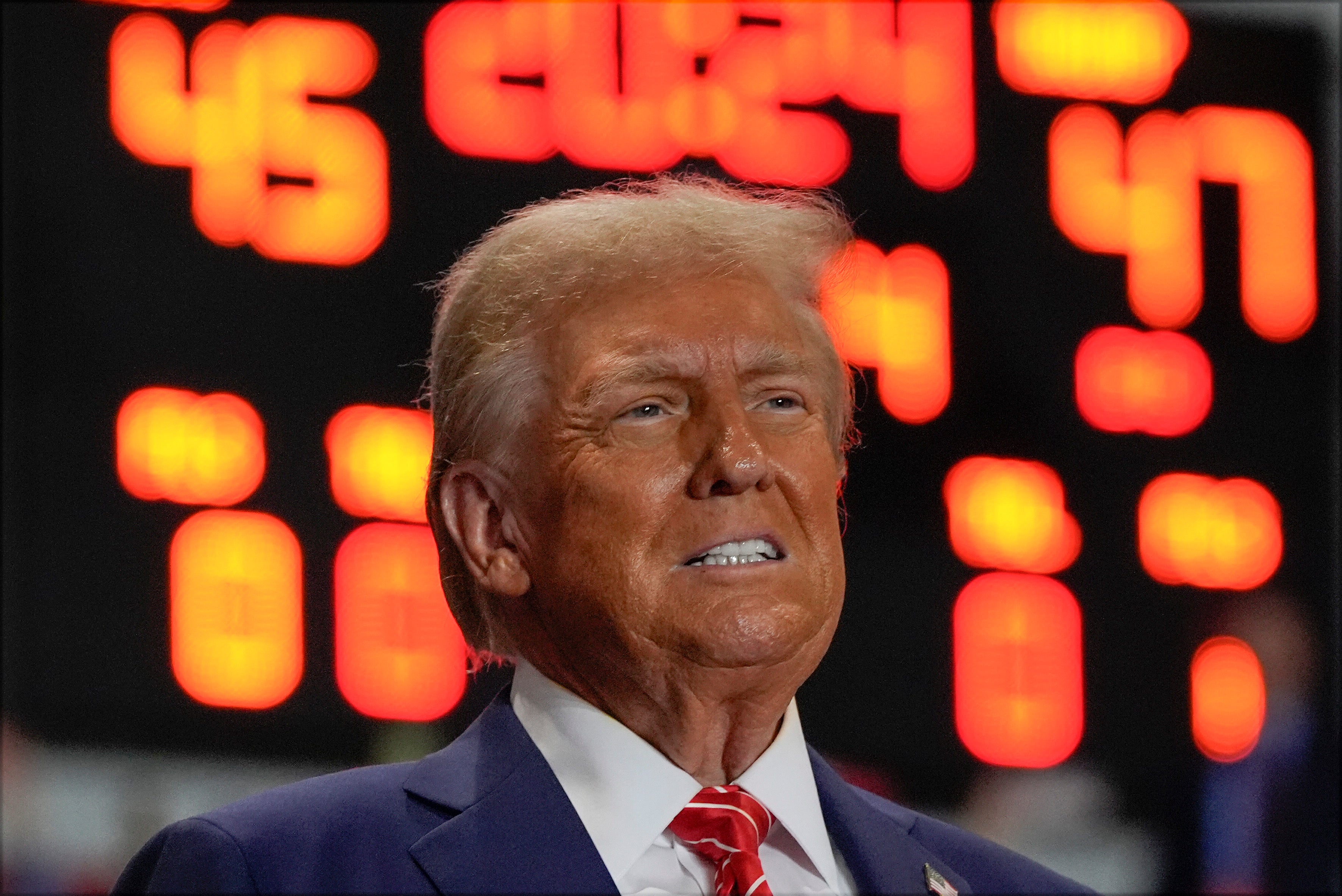 Trump arrives at a campaign rally at Rocky Mount Event Center, North Carolina. Photos appear to show him wearing heavy makeup at public events