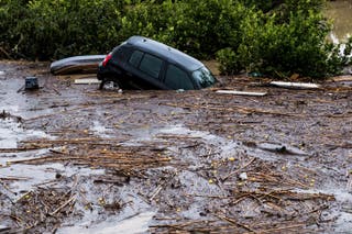 A car submerged in muddy water in Malaga, Spain (AP Photo/Gregorio Marrero)