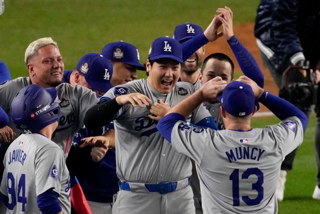 Los Angeles Dodgers’ Shohei Ohtani celebrates their win against the New York Yankees (Frank Franklin II/AP)