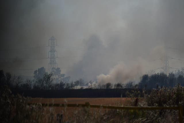 Heatwaves in the UK in 2022 caused wildfires (Yui Mok/PA)